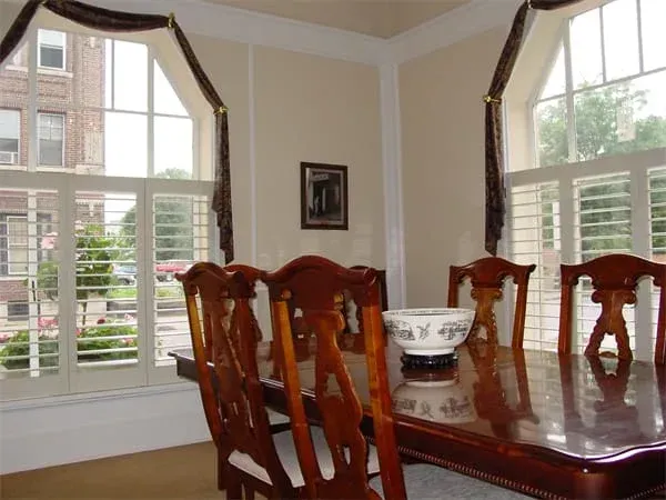 a dining room with a table and chairs and a bowl on the table