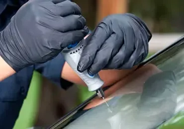 man-repairing-windshield