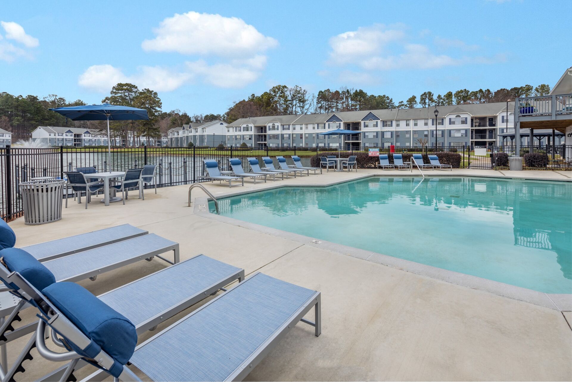 The Bentley at Marietta | Poolside View with Chairs and Tables