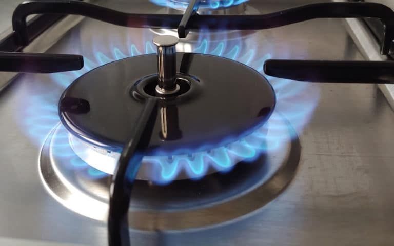 A Close Up Of A Gas Burner With Blue Flames — ARK Plumbing & Gasfitting In Moss Vale, NSW