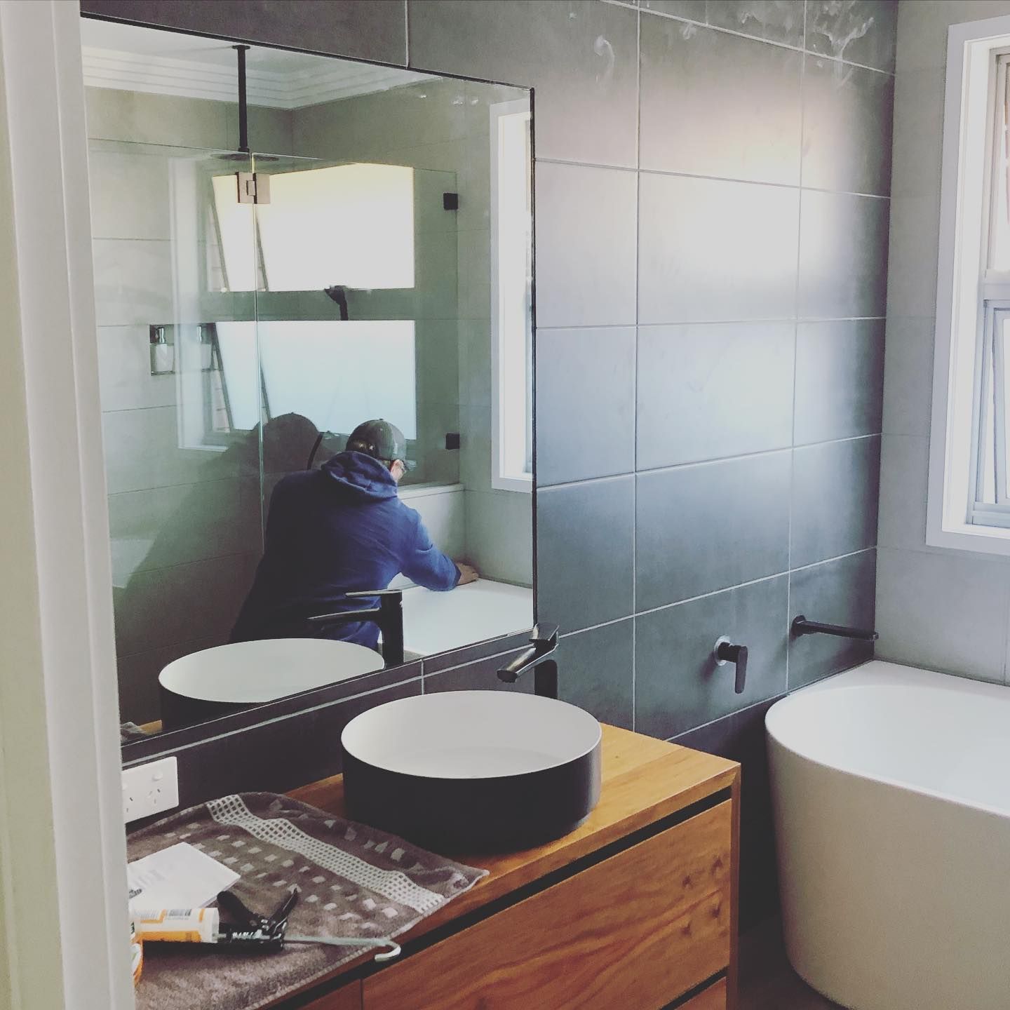 A Bathroom With Two Sinks And A Large Mirror — ARK Plumbing & Gasfitting In Berrima, NSW