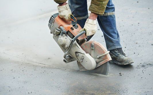 Construction Worker with Cut-off Machine - Asphalt in Medina, MN