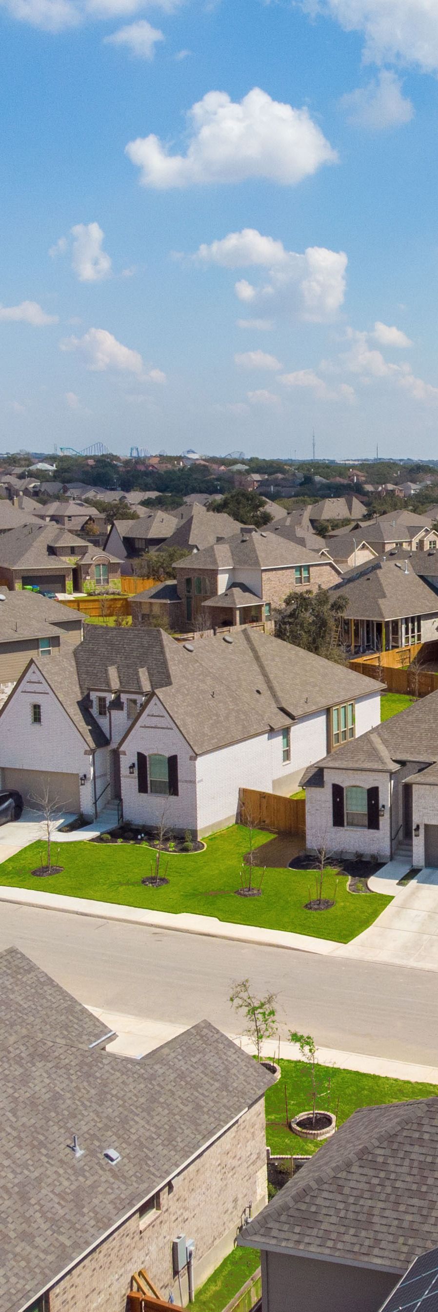 A large house with a swimming pool in front of it