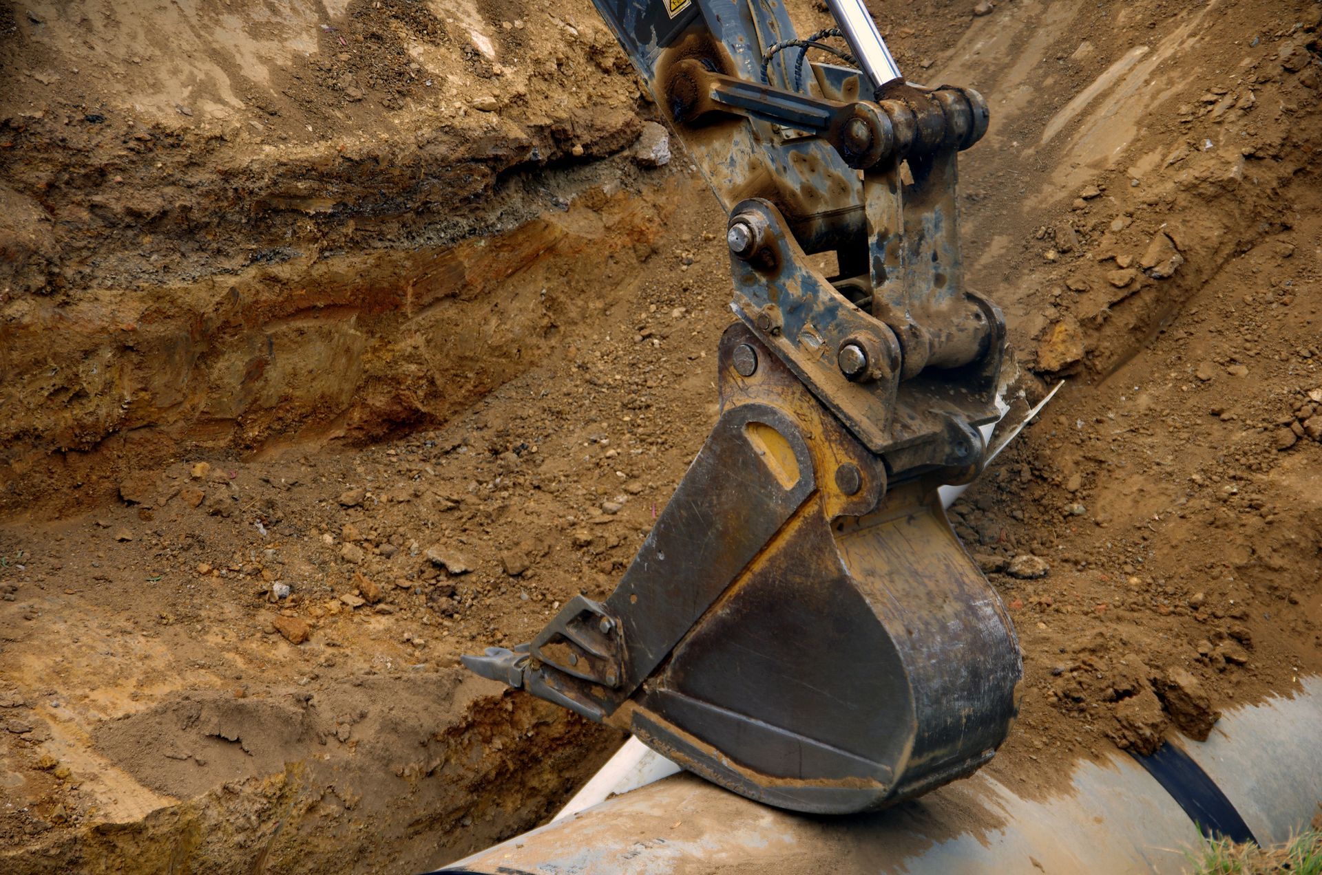 A bulldozer is digging a hole in the ground.