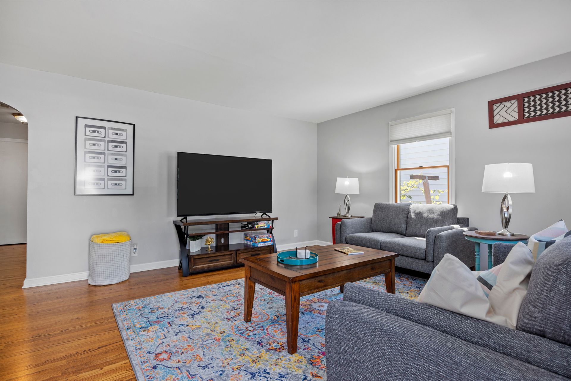 A living room filled with furniture and a flat screen tv.