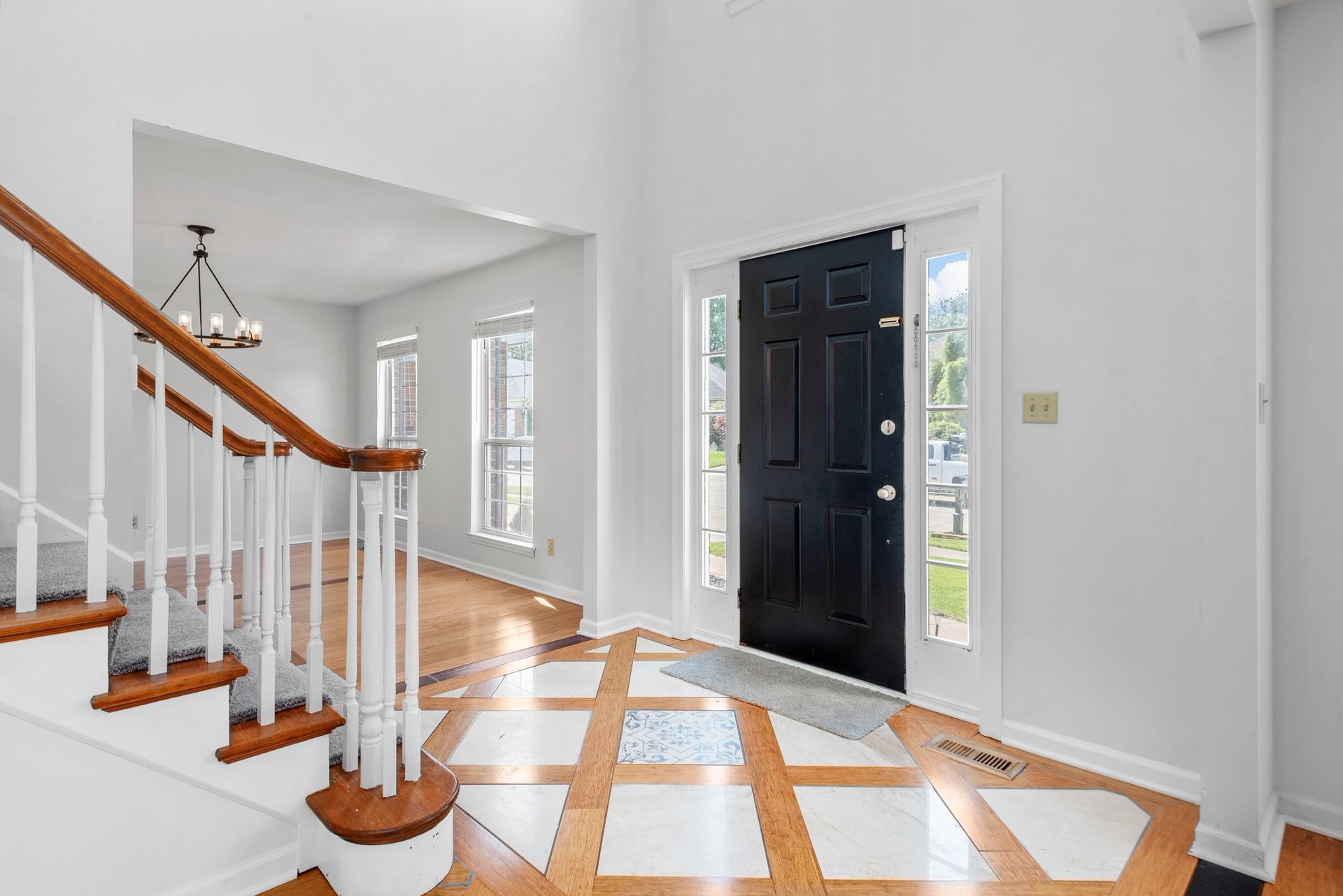 There is a staircase leading up to the front door of a house.