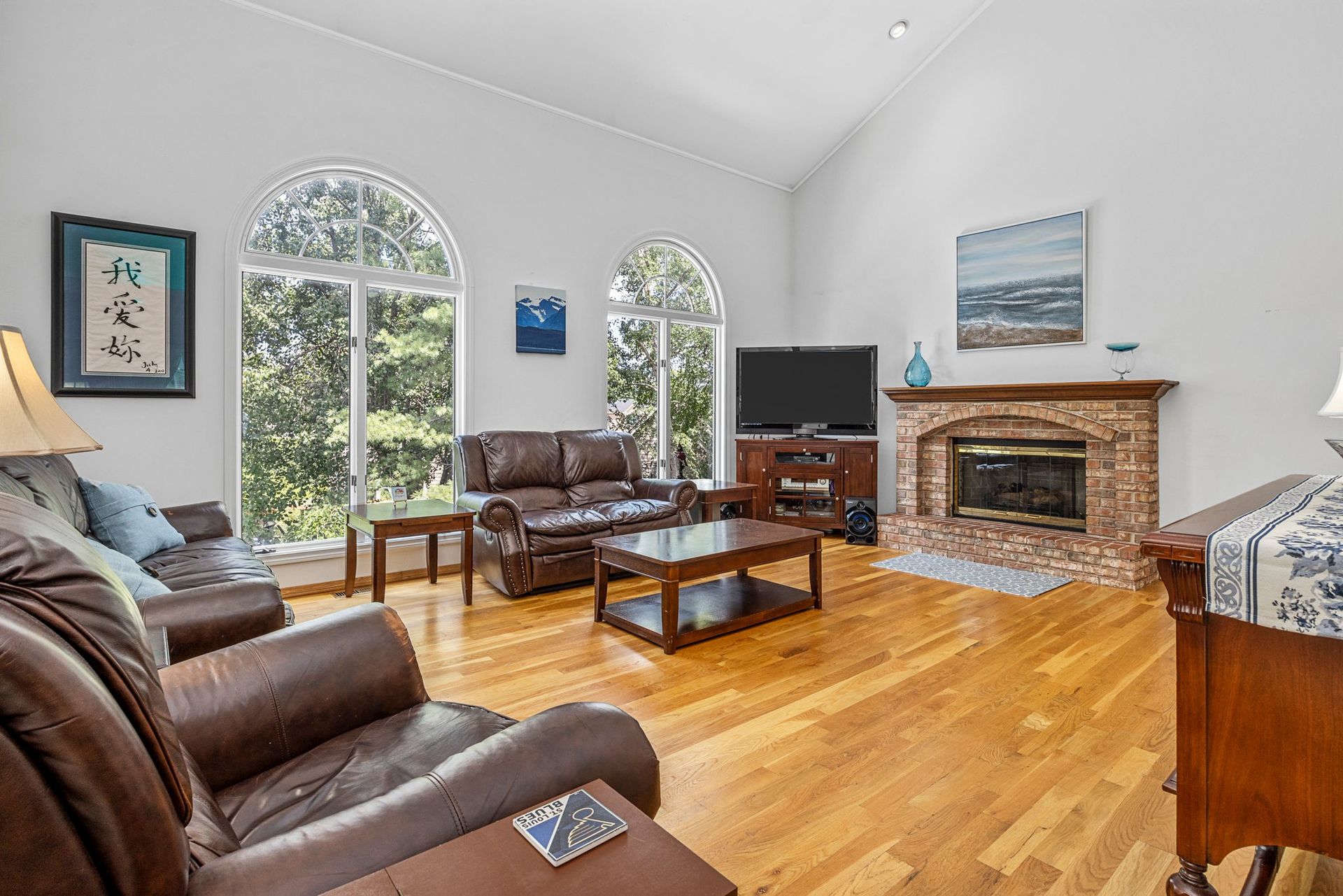 A living room filled with furniture and a fireplace.