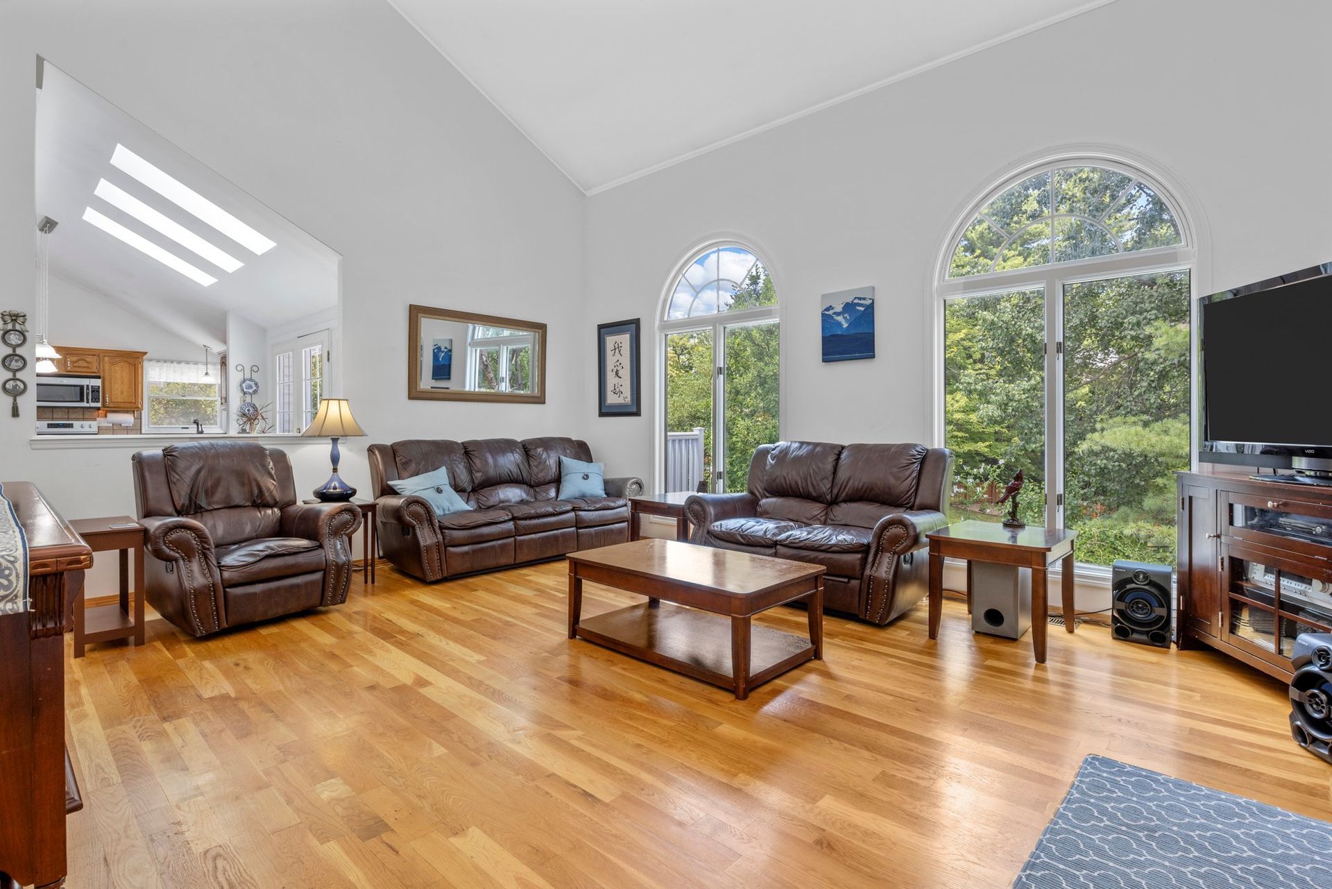 A living room filled with furniture and a flat screen tv.