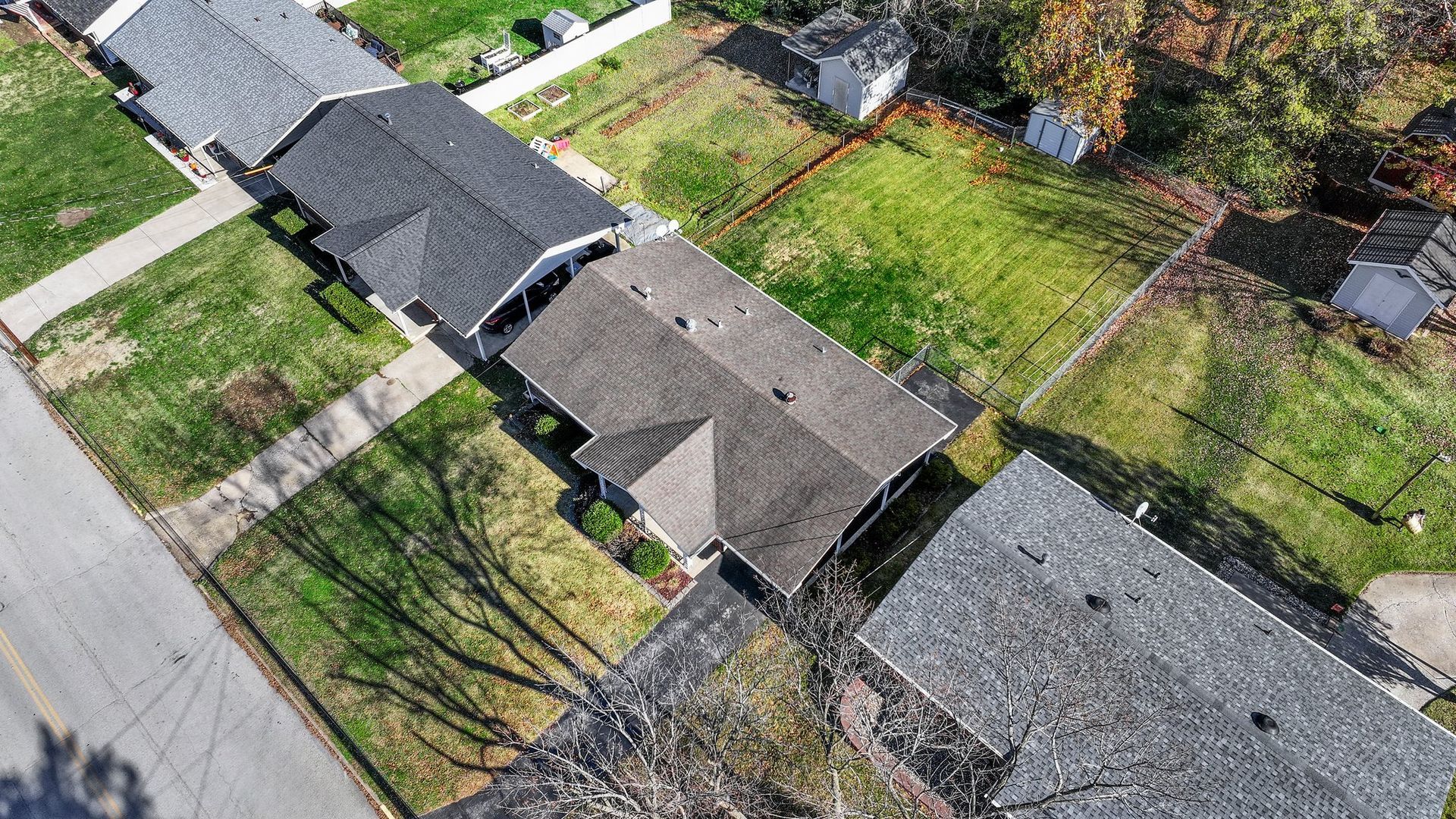An aerial view of a row of houses in a residential neighborhood.