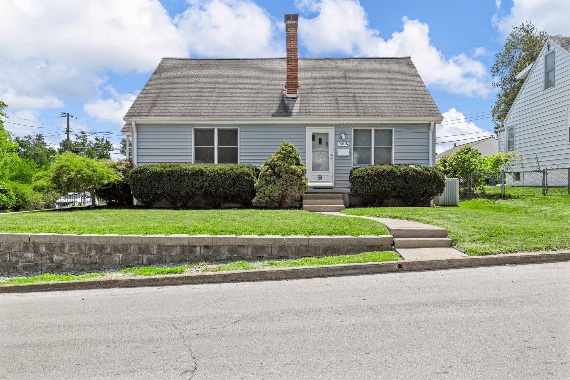 A small house with a chimney on the roof