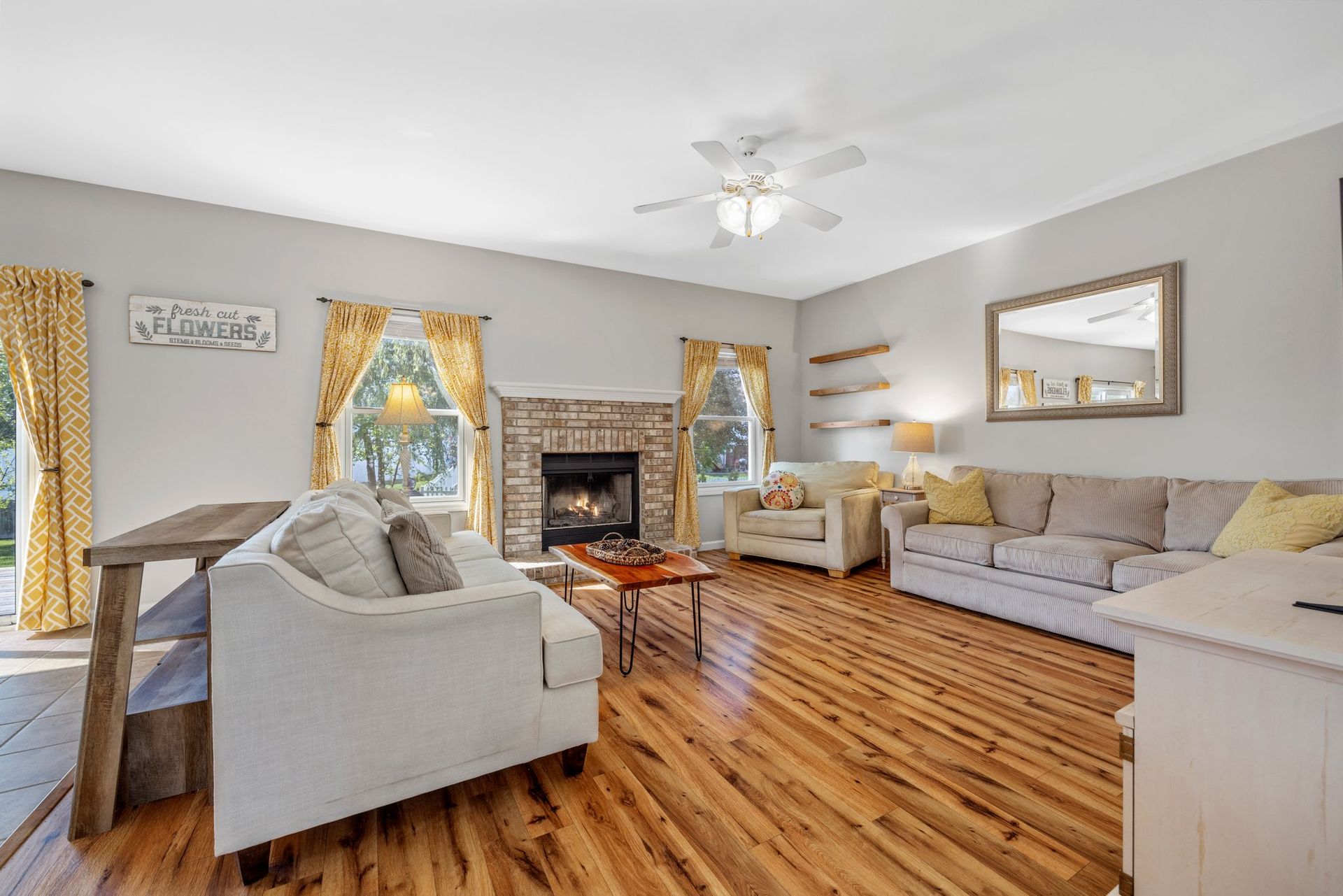 A living room filled with furniture and a fireplace.