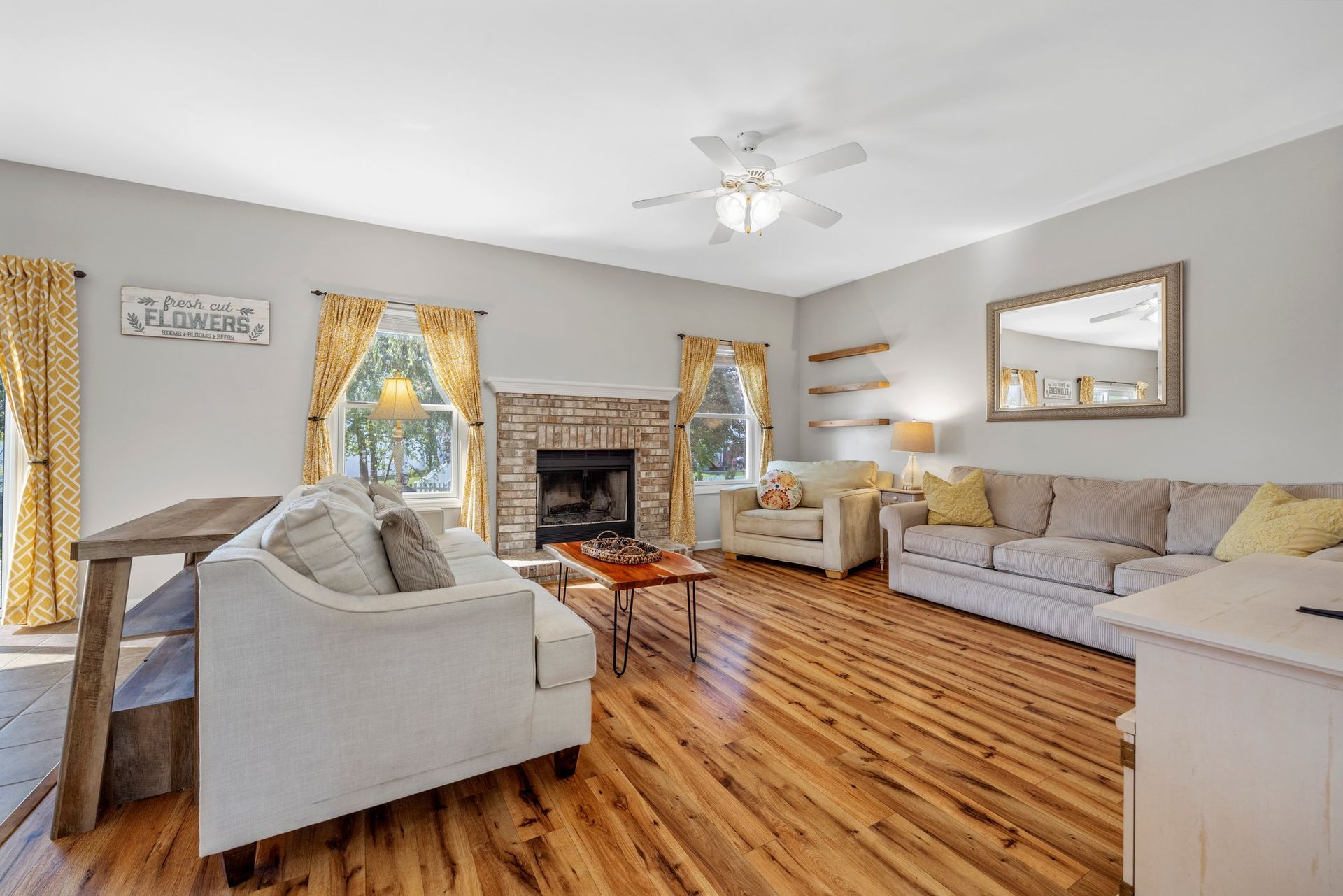 A living room filled with furniture and a fireplace.