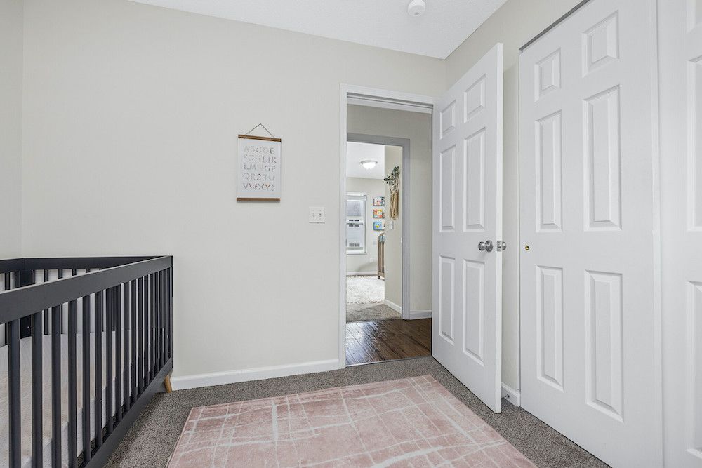 There is a crib in the middle of the room.
