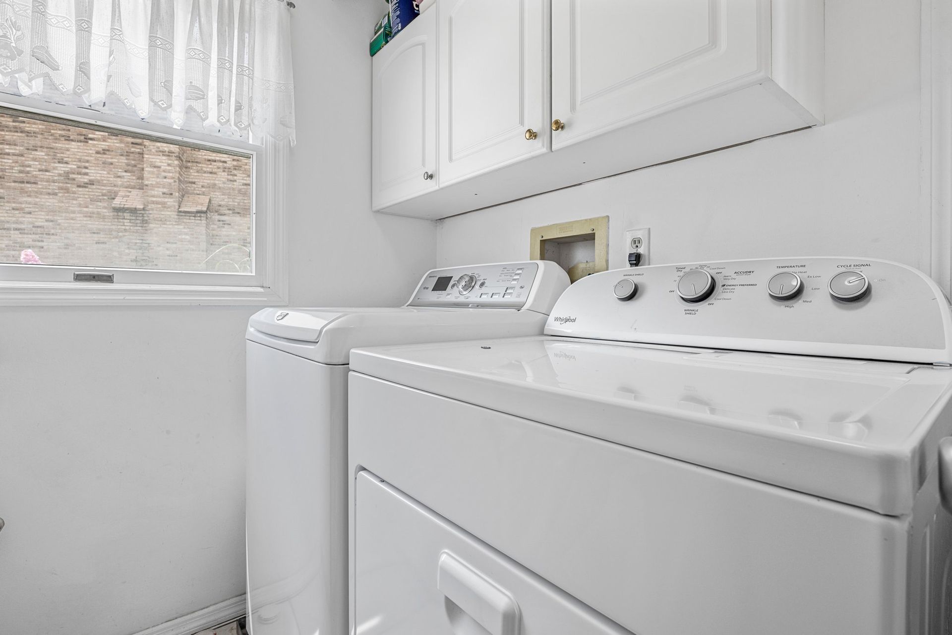 There is a washer and dryer in the laundry room.