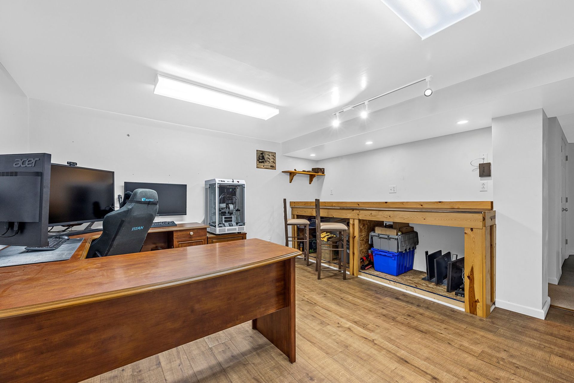 There is a wooden desk in the middle of the room.