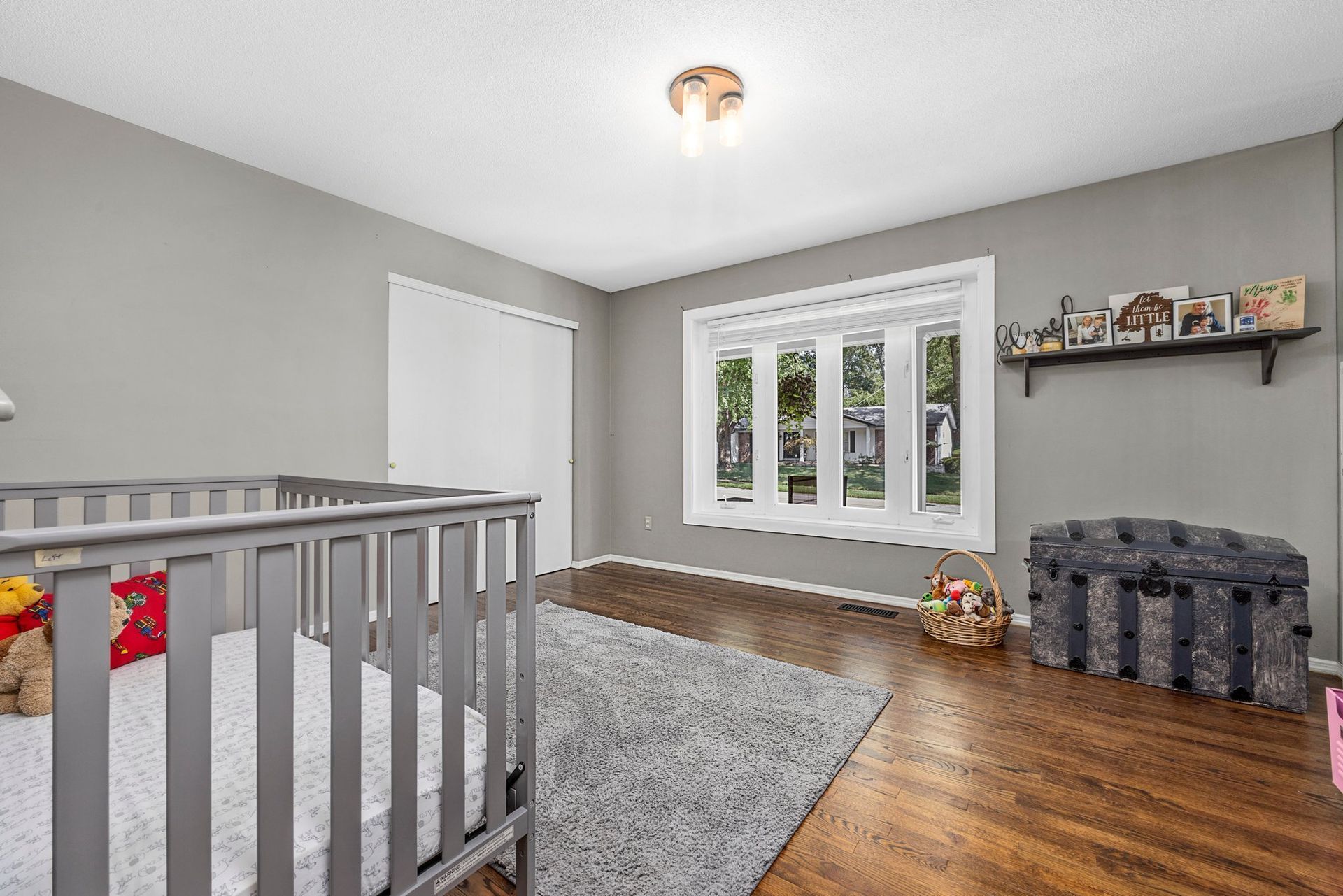 There is a crib in the middle of the room.