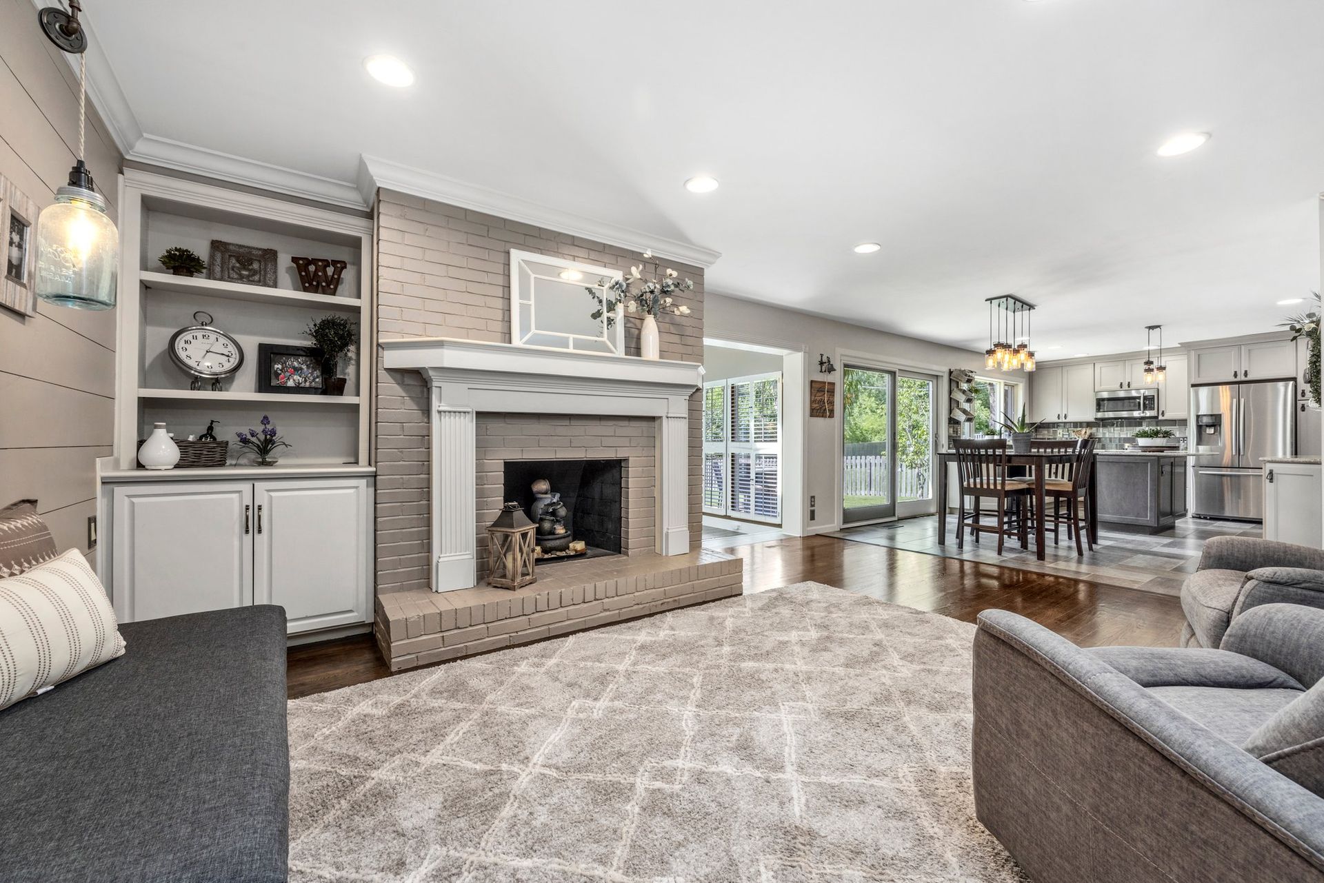 A living room filled with furniture and a fireplace.