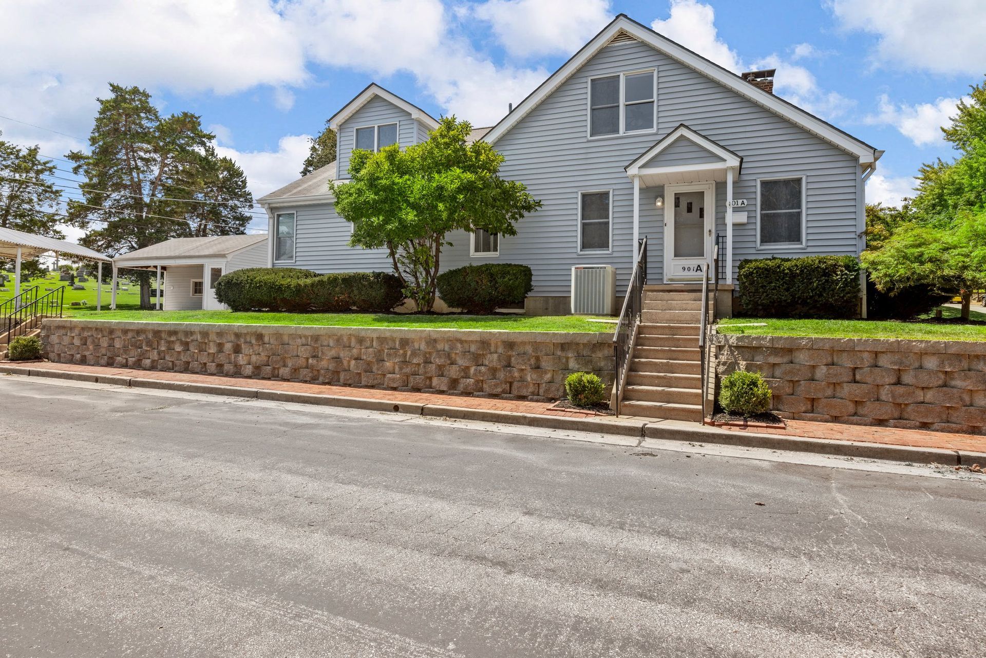 A house with stairs leading up to the front door