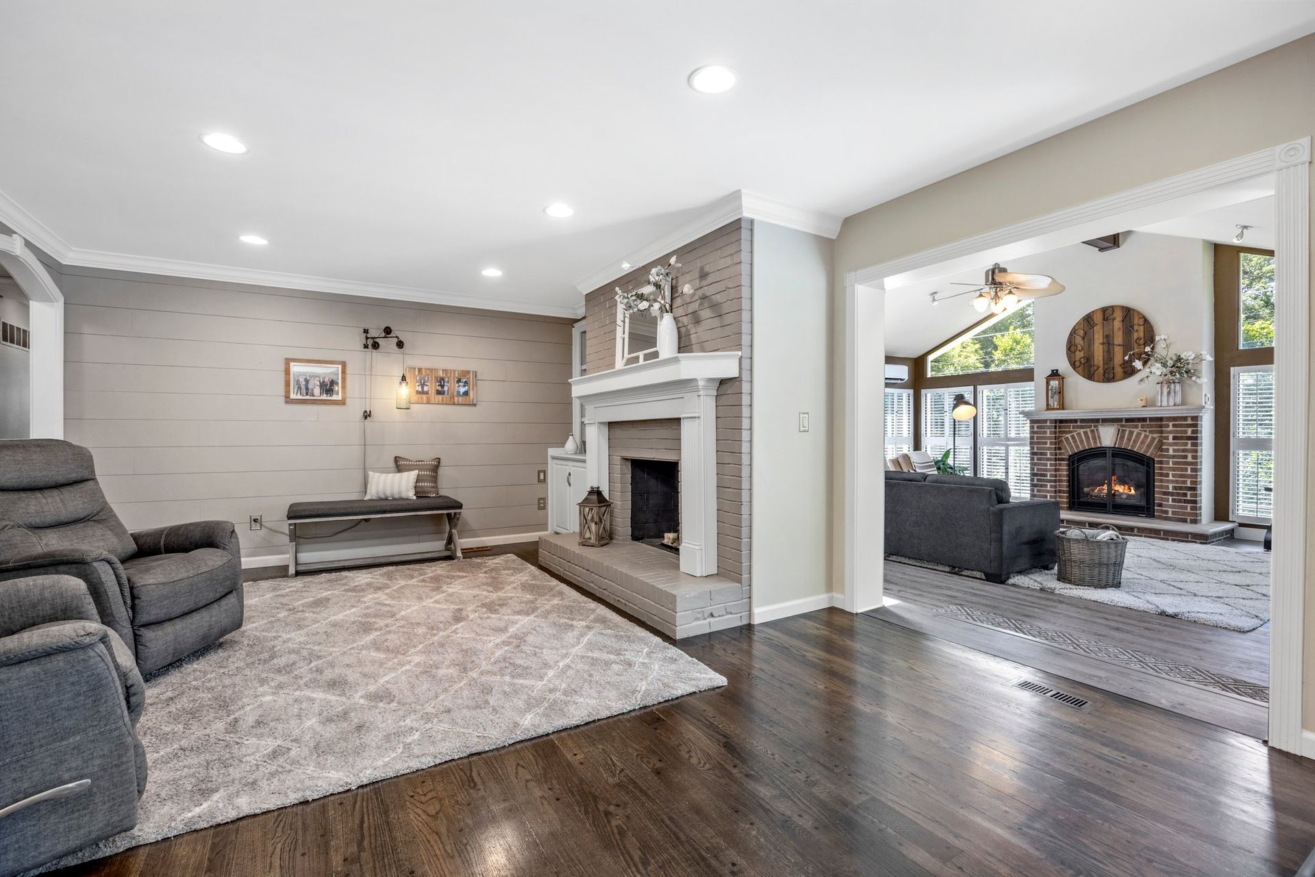 A living room filled with furniture and a fireplace.