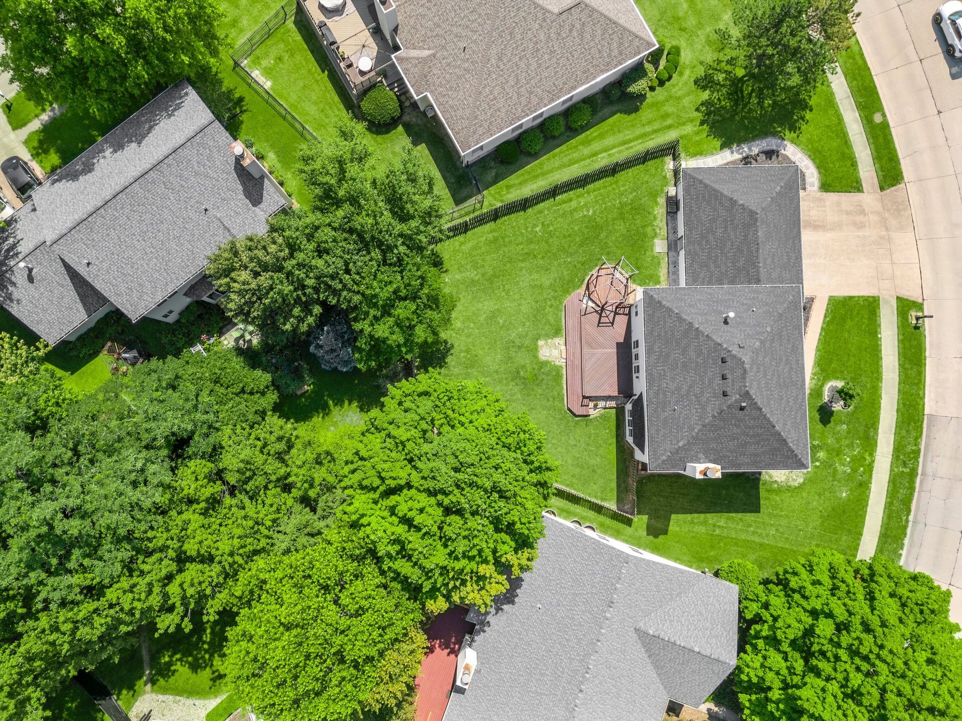 An aerial view of a residential area with houses and trees