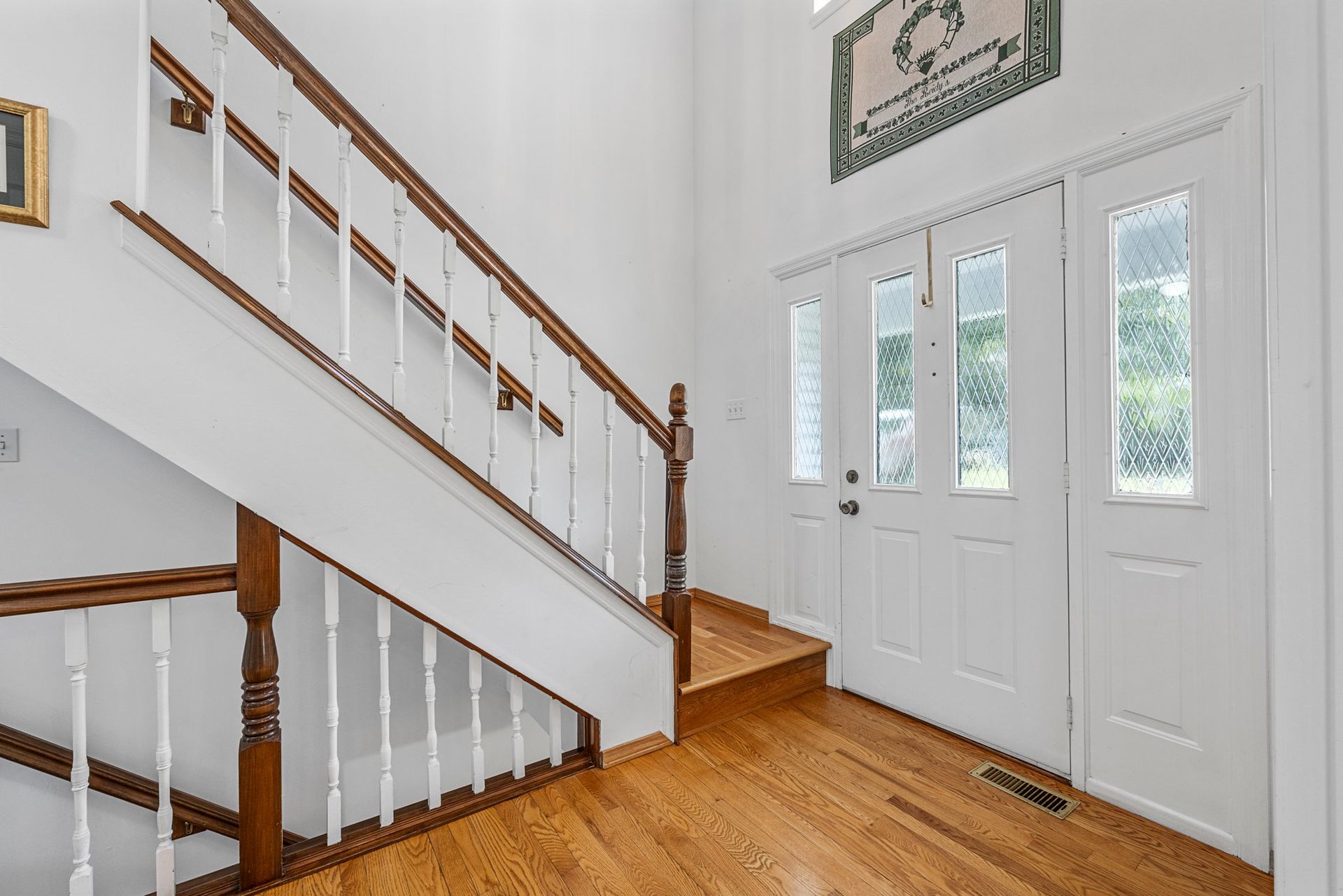 There is a staircase leading up to the second floor of a house.