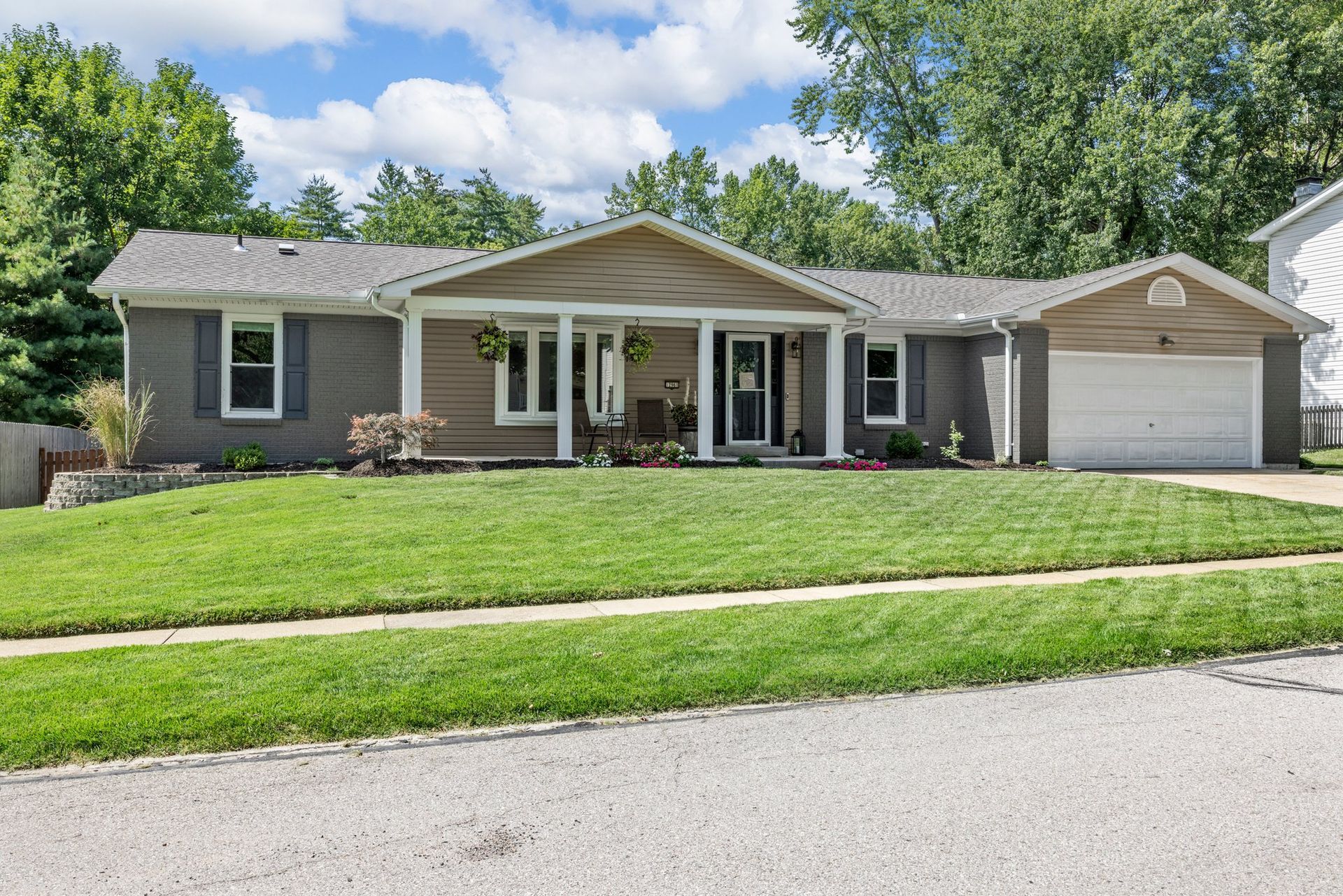 A large house with a large lawn in front of it