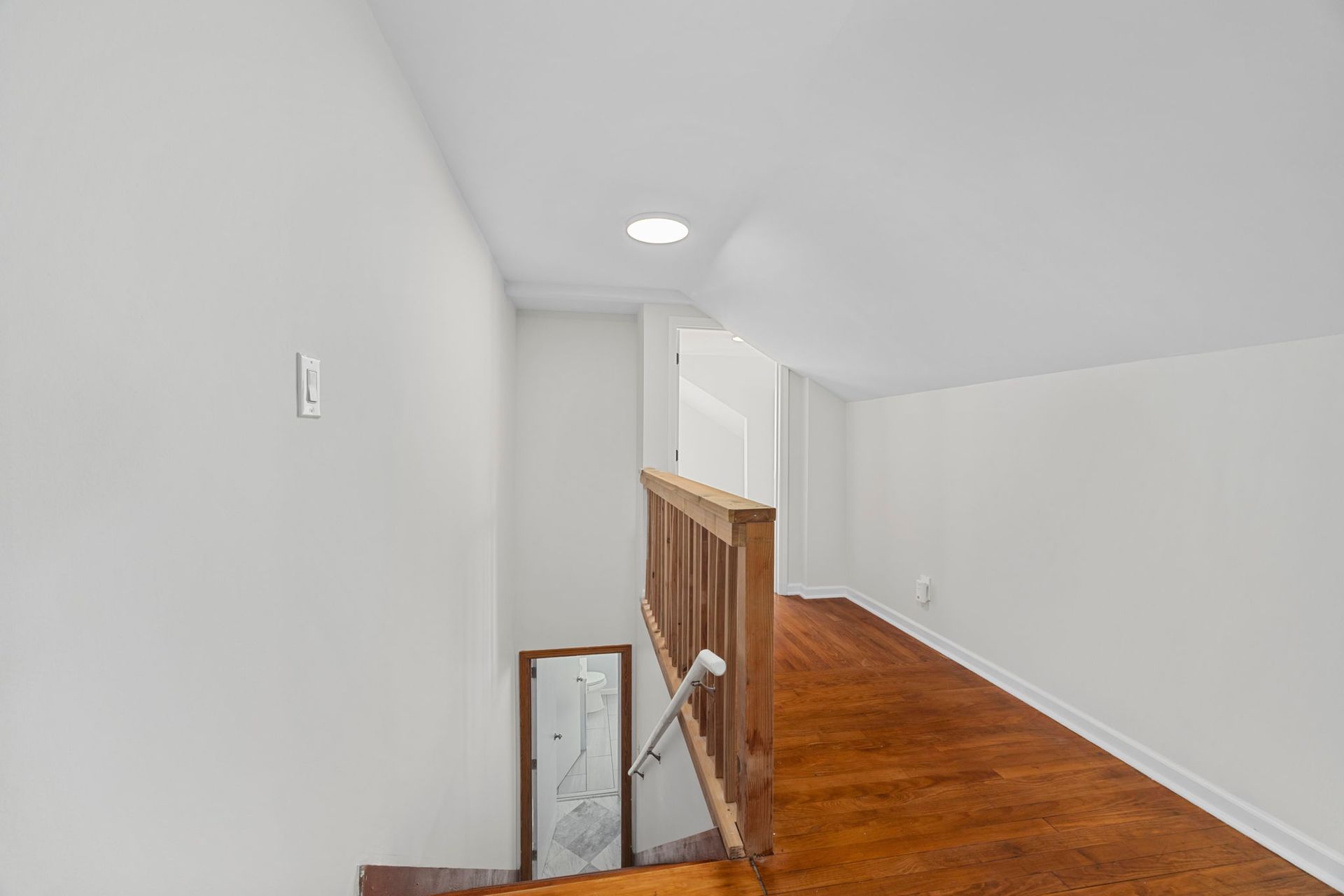 There is a staircase leading up to the second floor of a house.