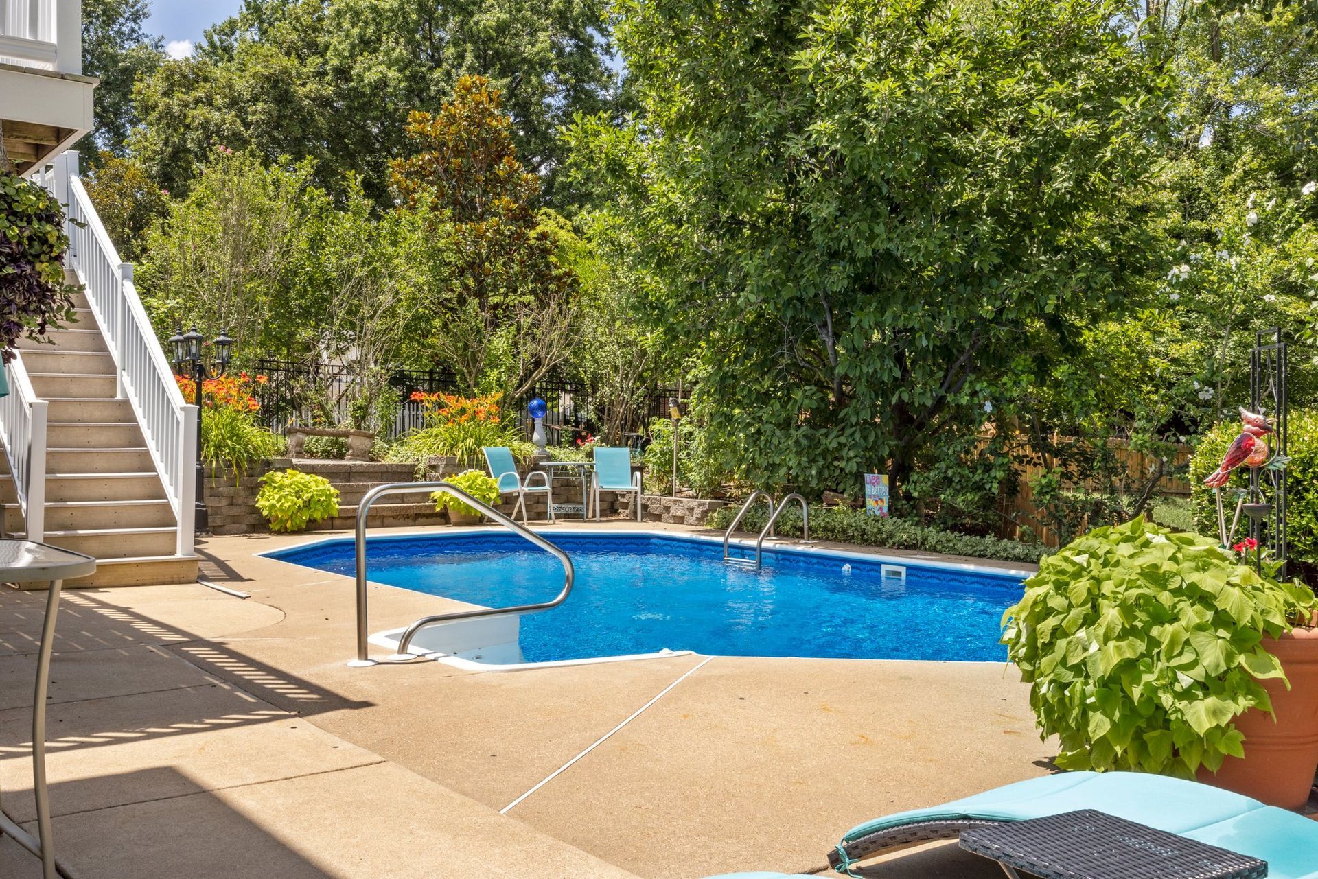 A large swimming pool in the backyard of a house