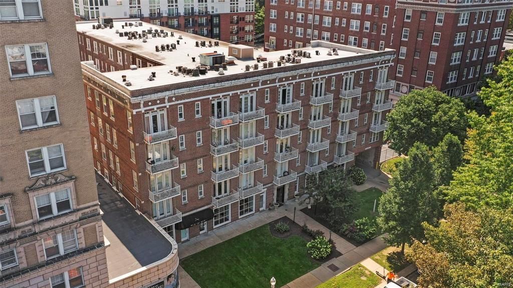 An aerial view of a large brick apartment building