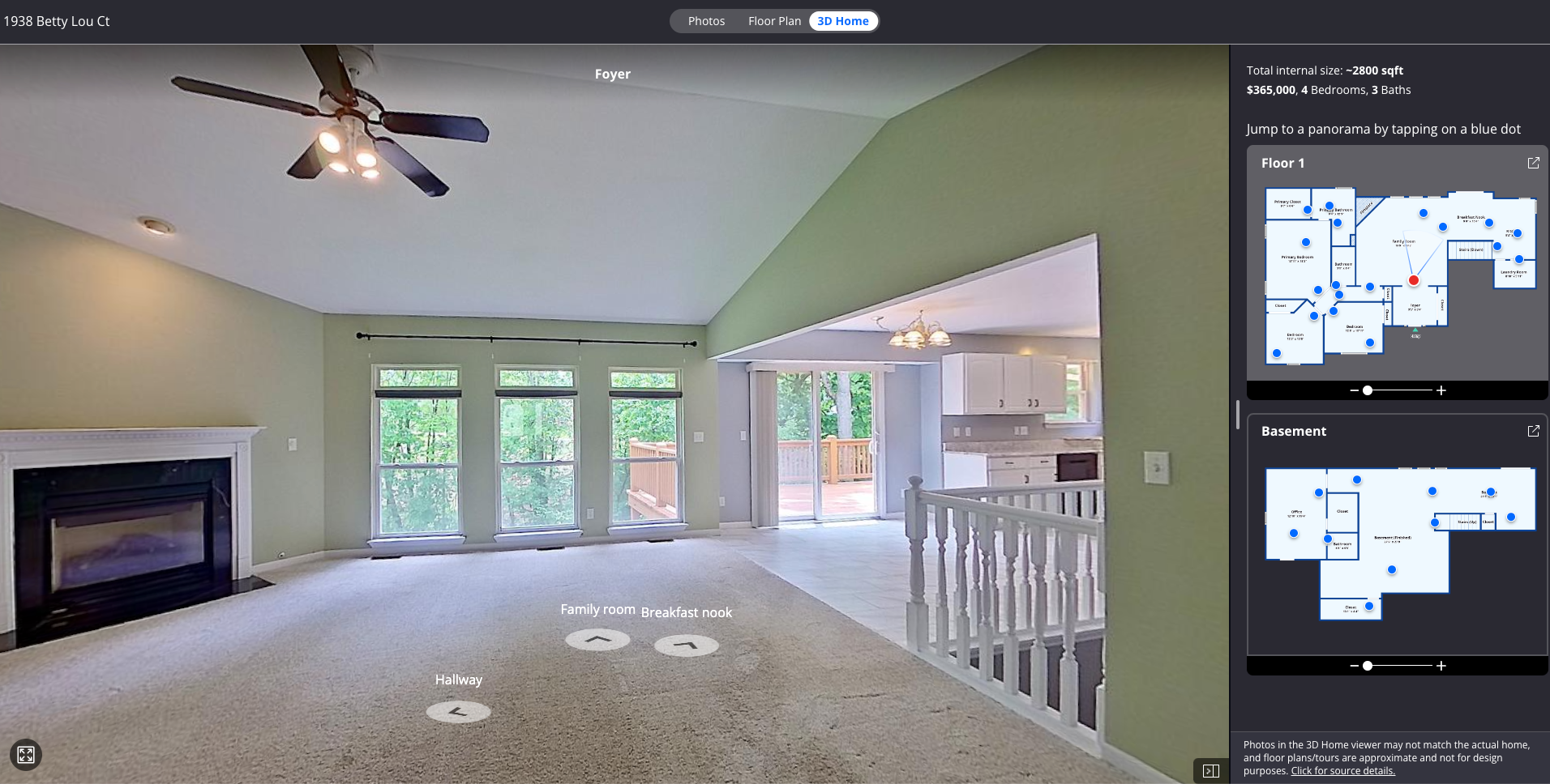 An empty living room with a fireplace and a ceiling fan.