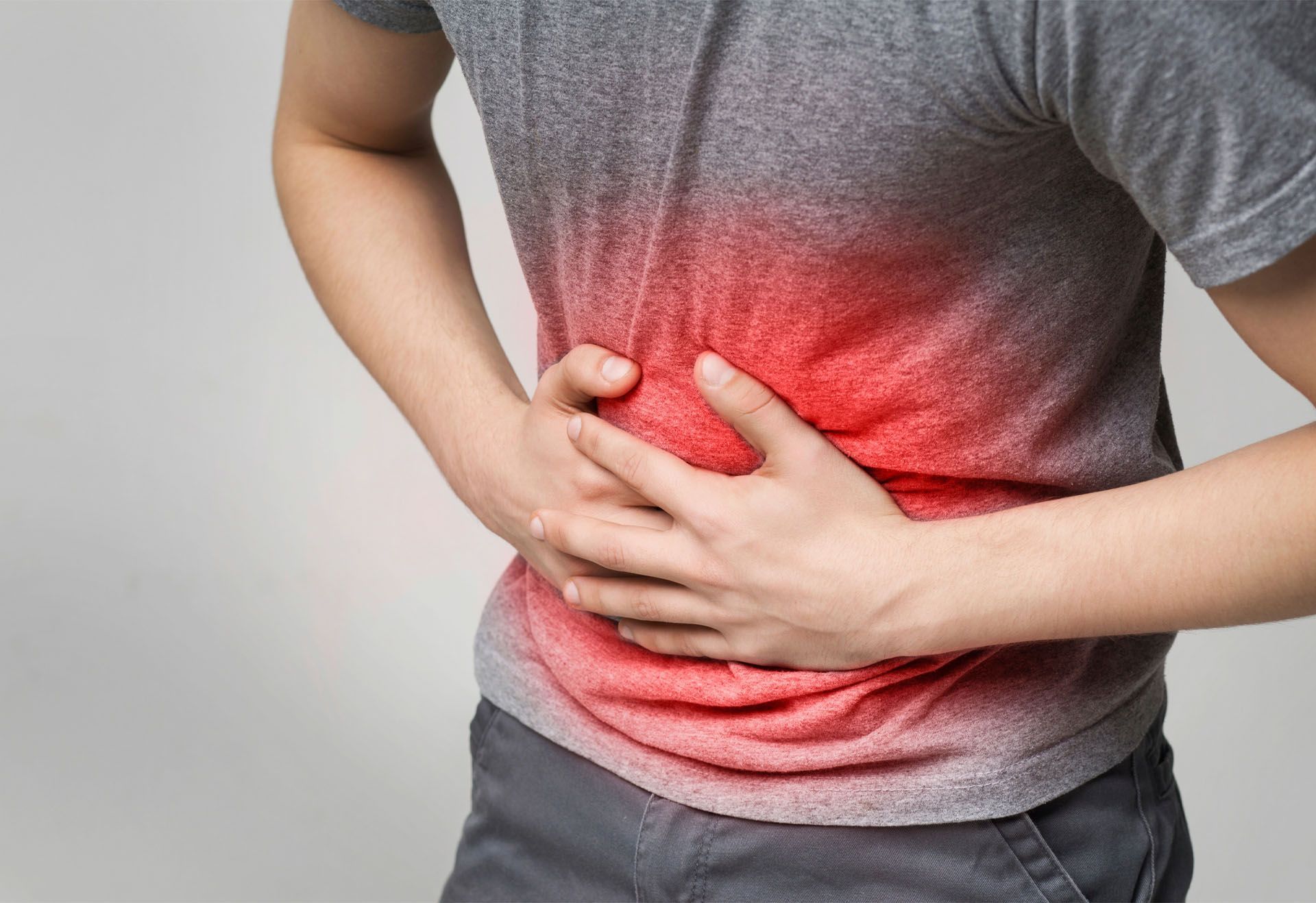 man experiencing stomach pain