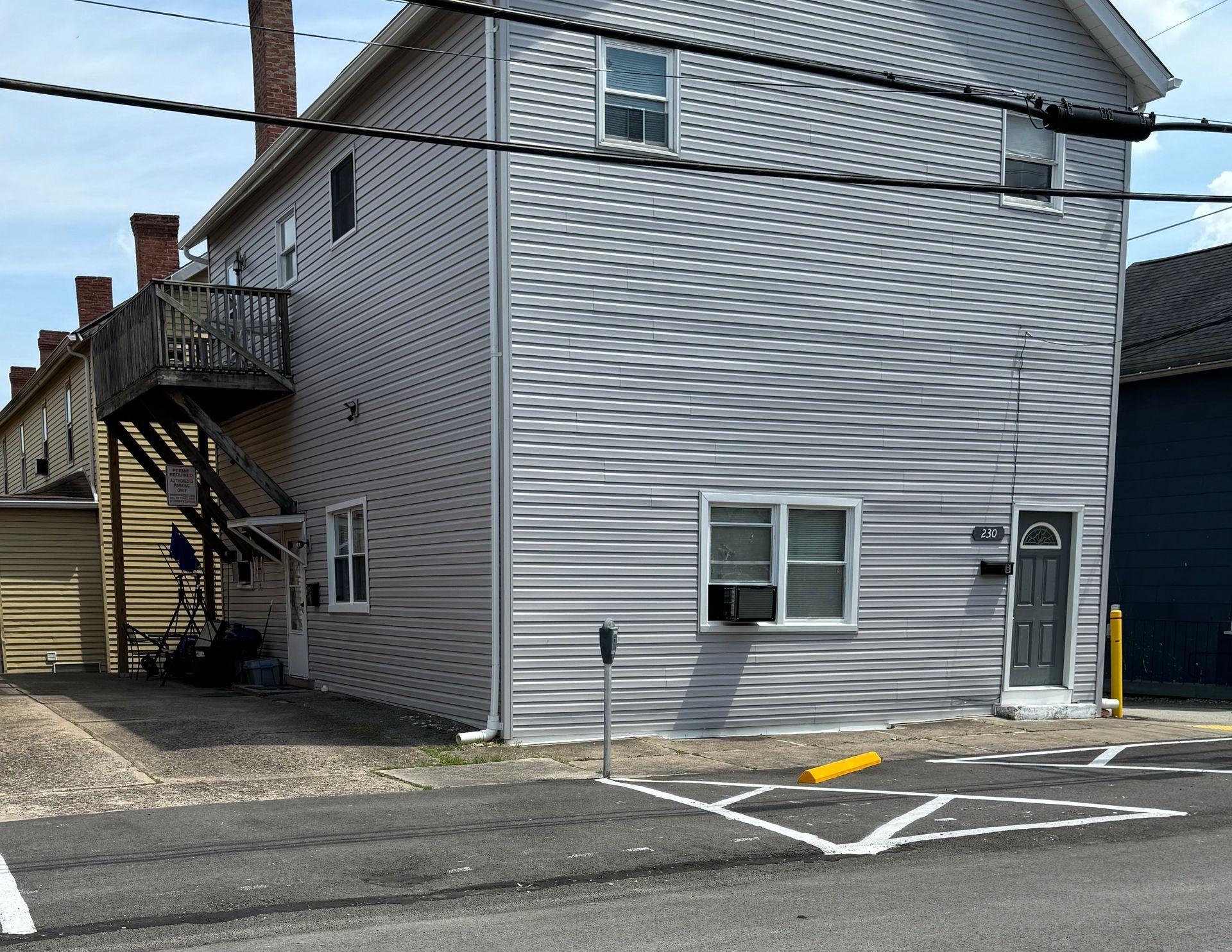 A house with a handicapped parking spot in front of it