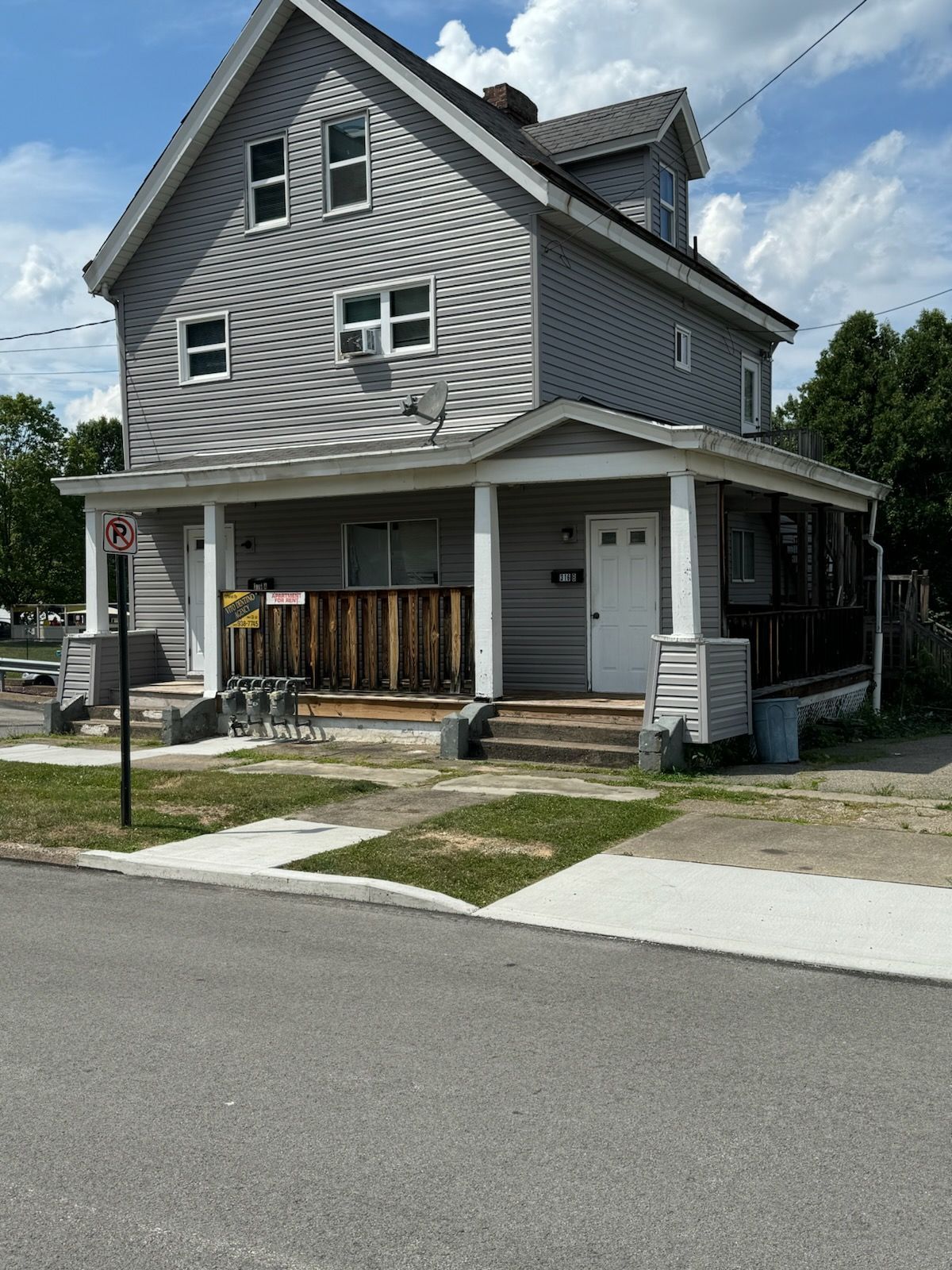 A house with a no parking sign in front of it