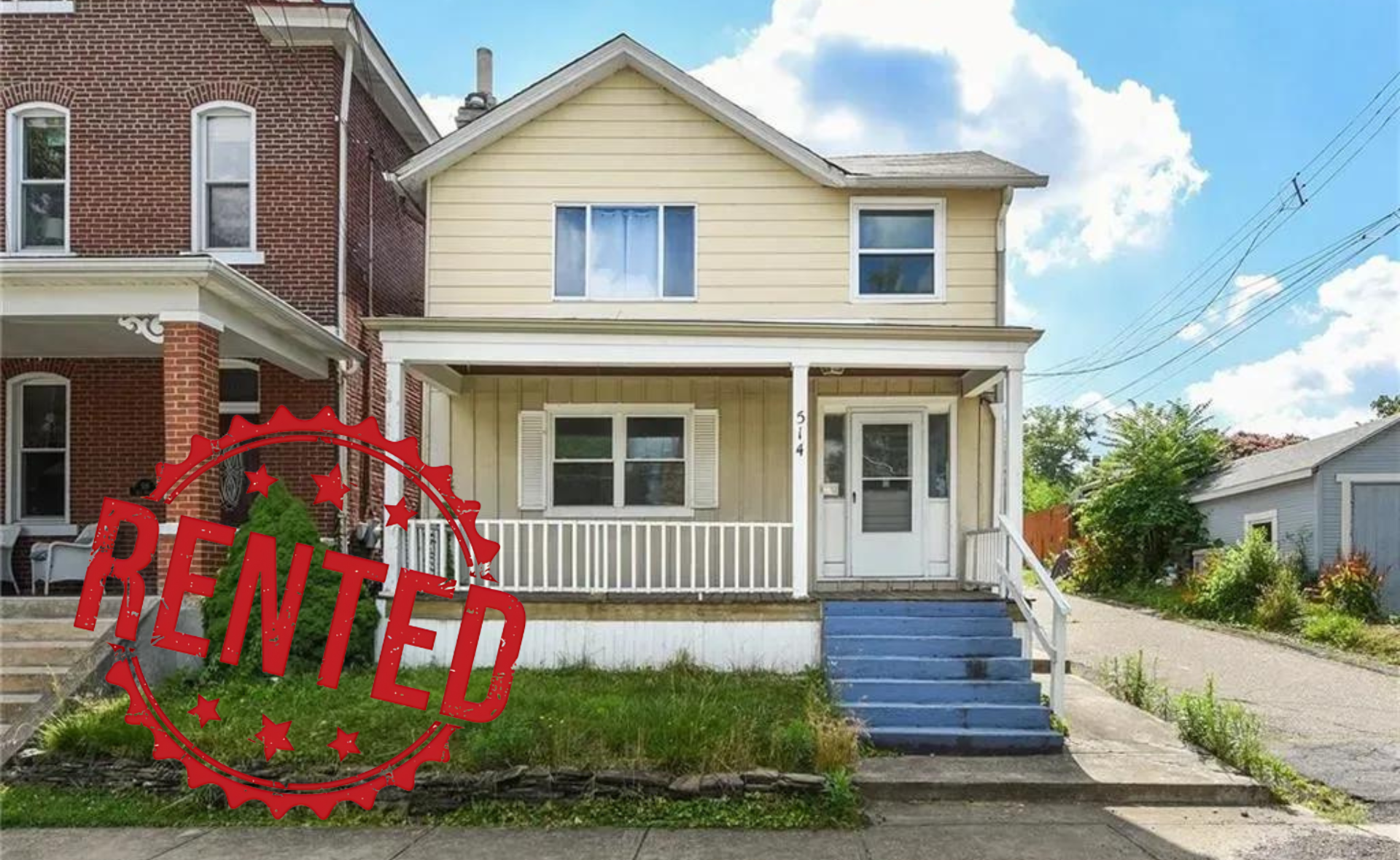 The front of a house with a porch and stairs