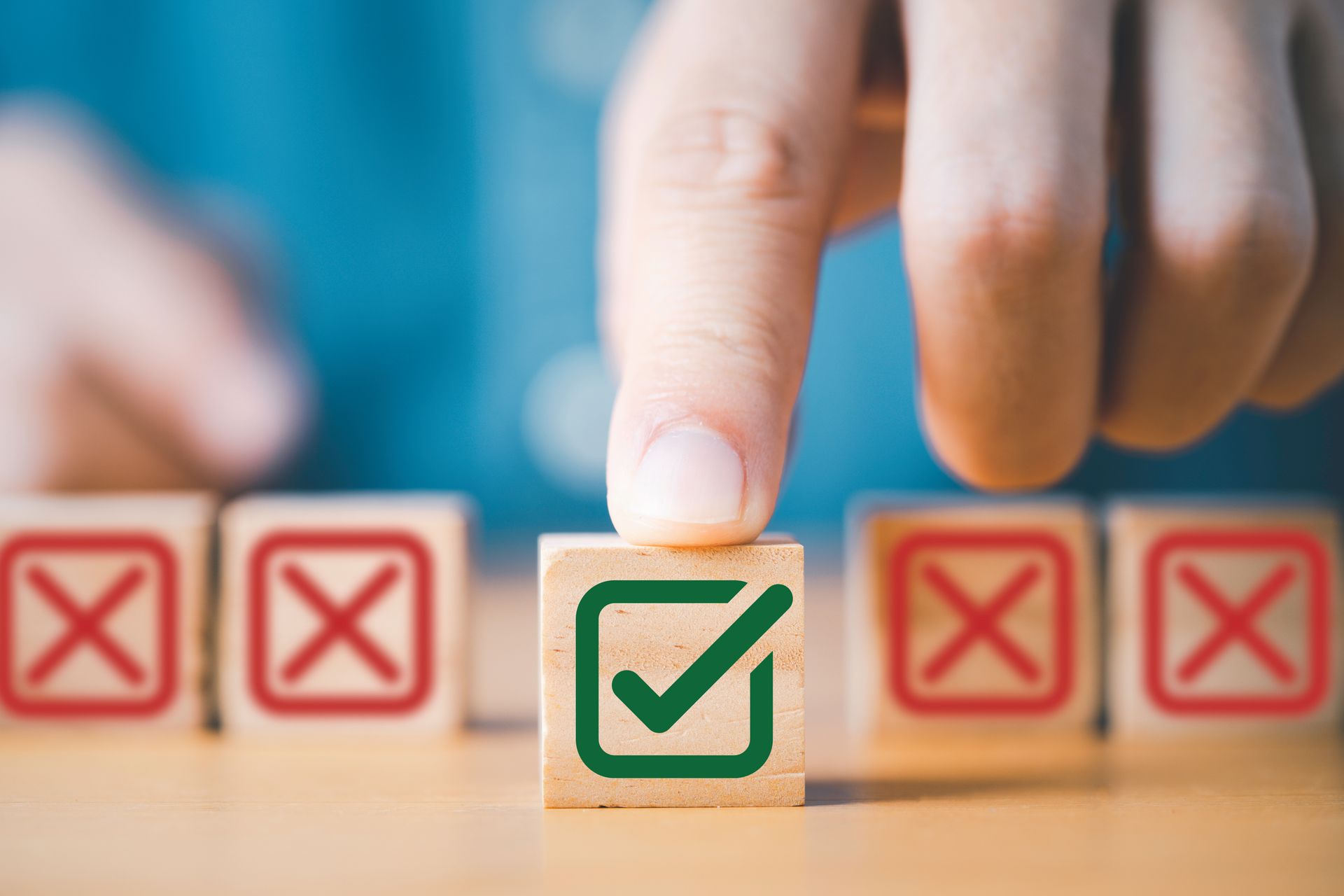 Person making the right decision. Choosing an item with a green checkmark over those with red x's.