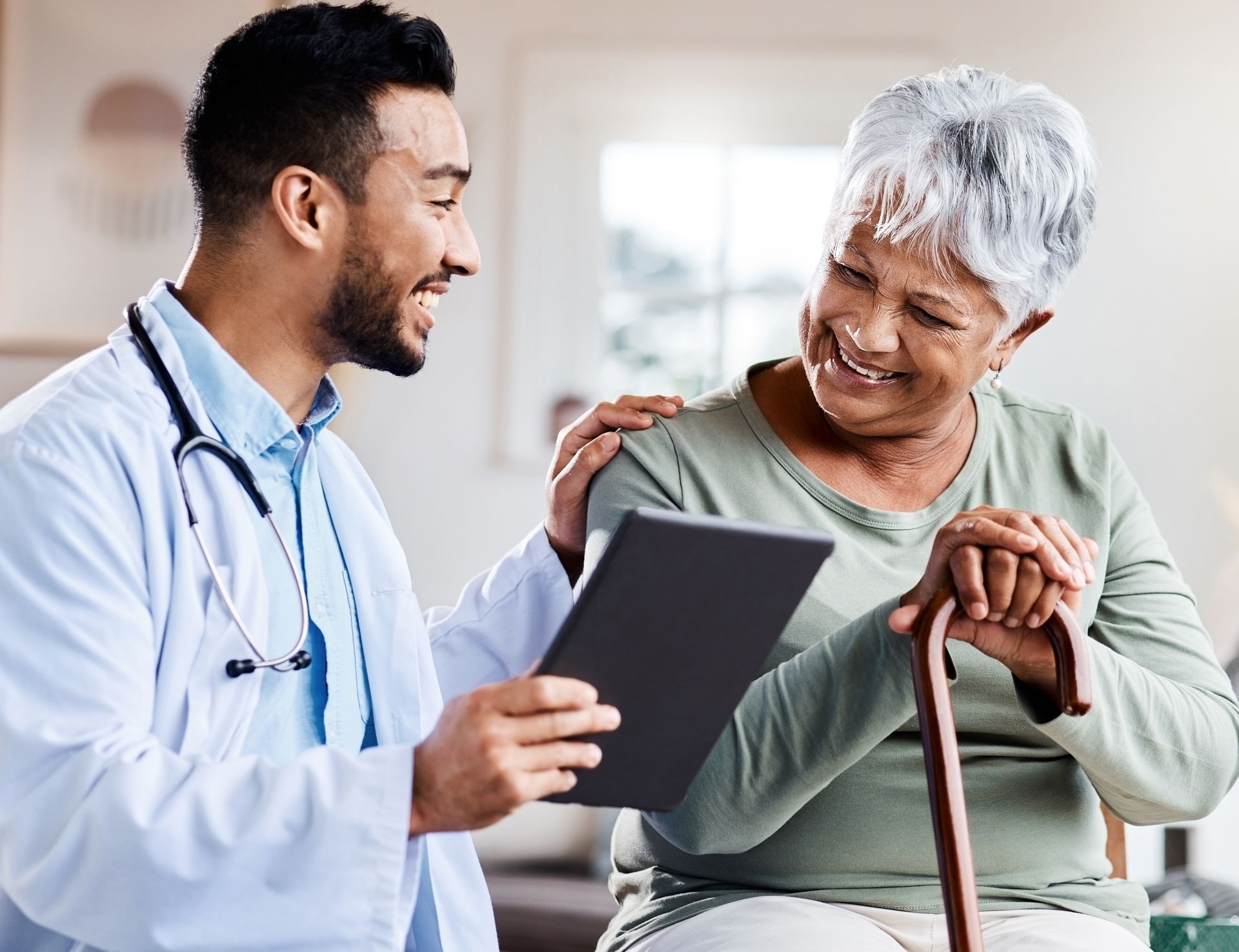 Physician talking with elderly patient