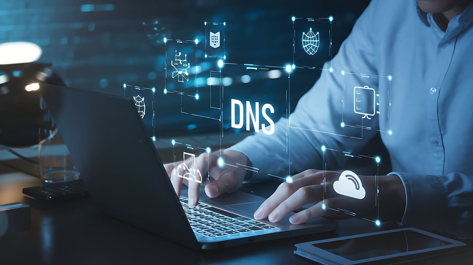 Person working on laptop with overlay of DNS