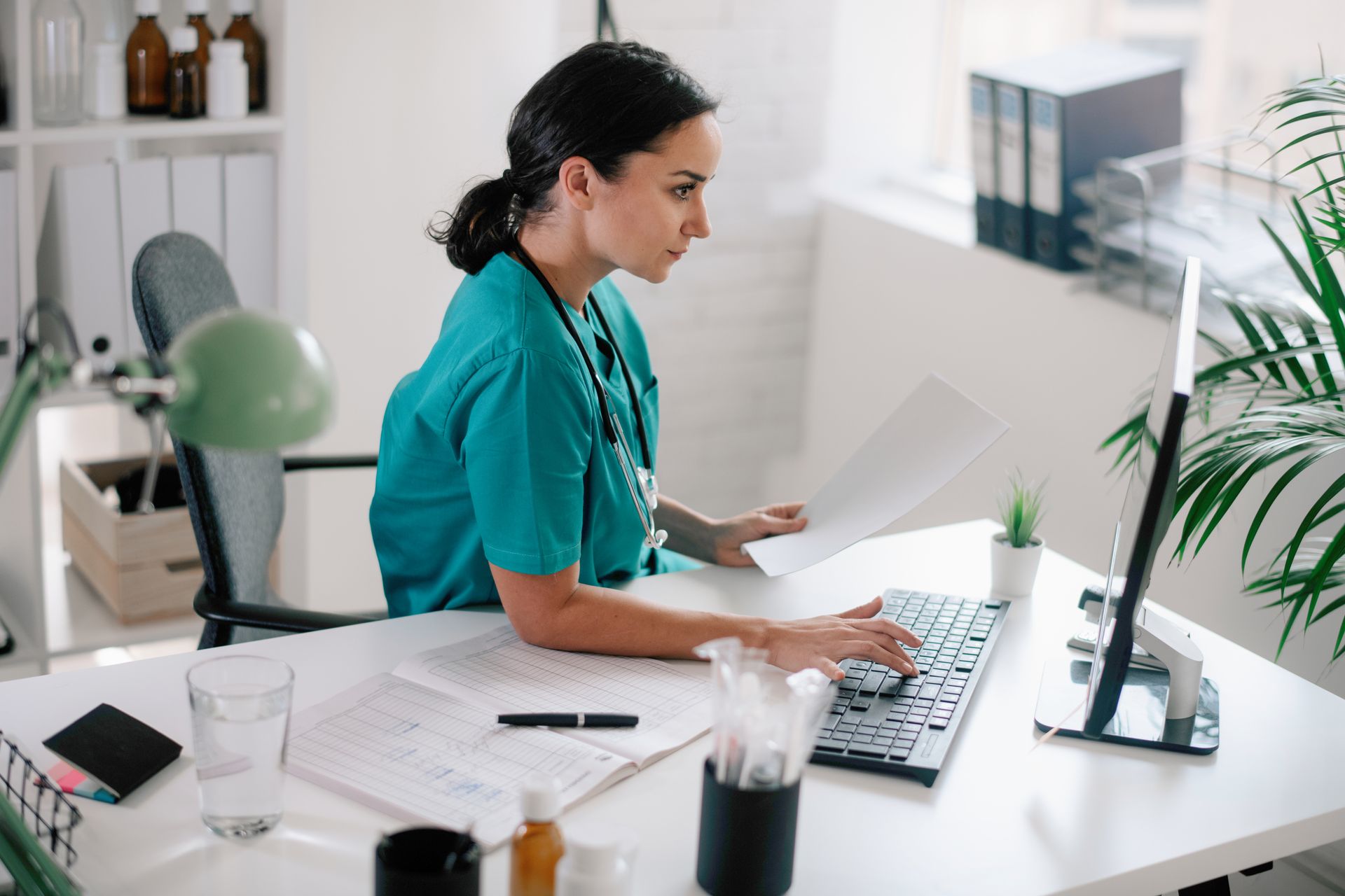 physician using computer to post comment on social media