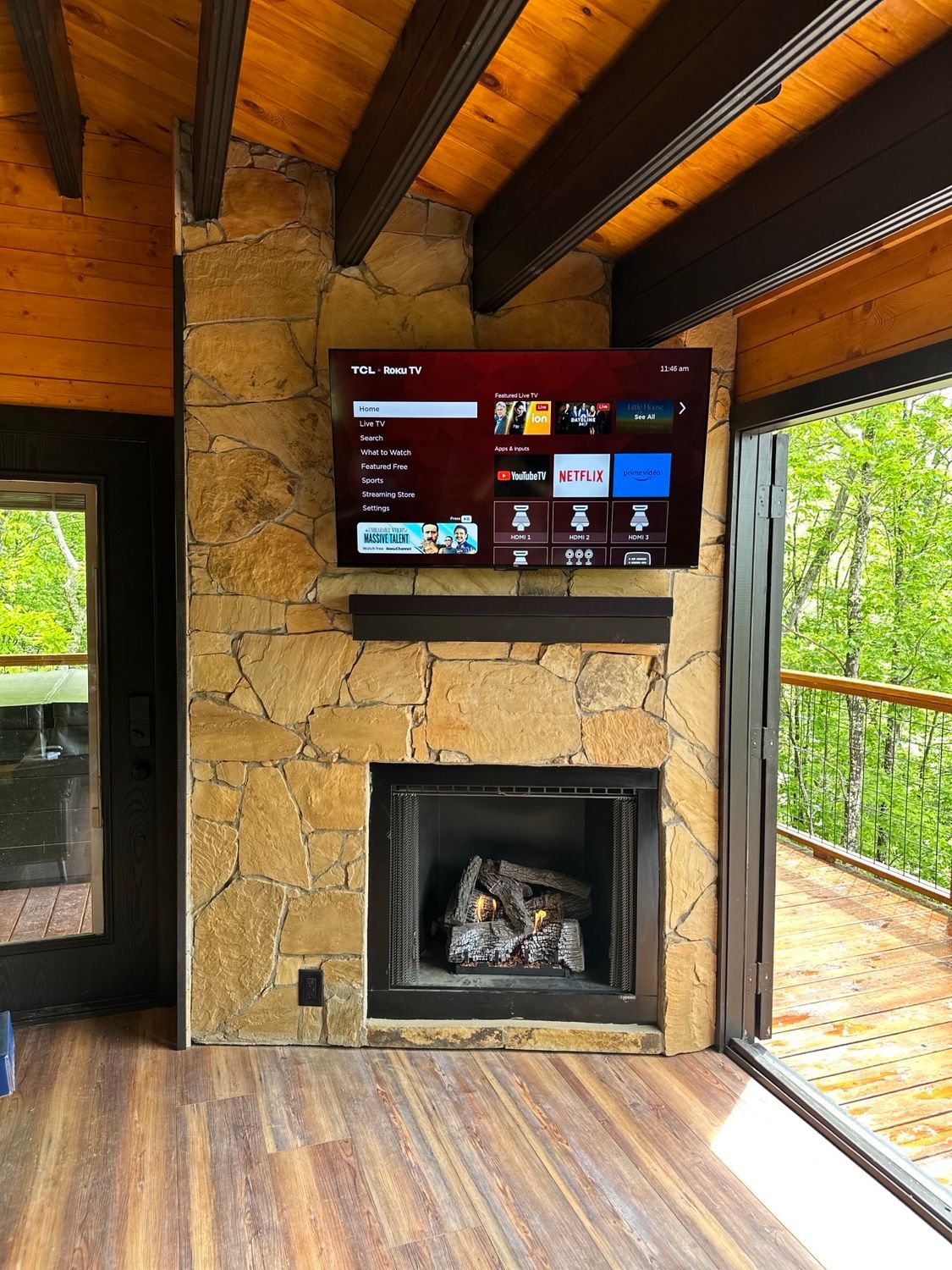 a living room with a fireplace and sliding glass doors