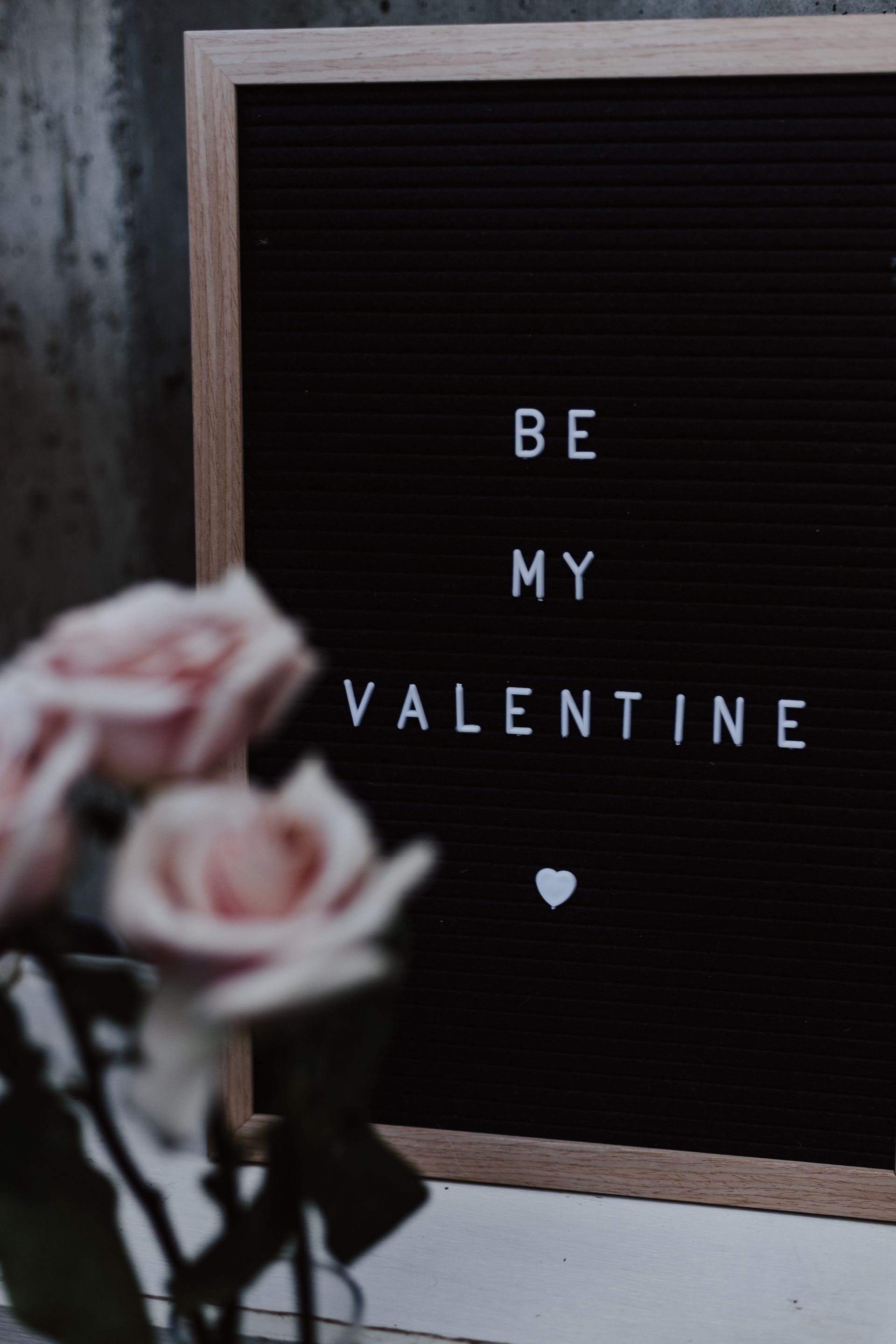a black board with the words be my valentine written on it