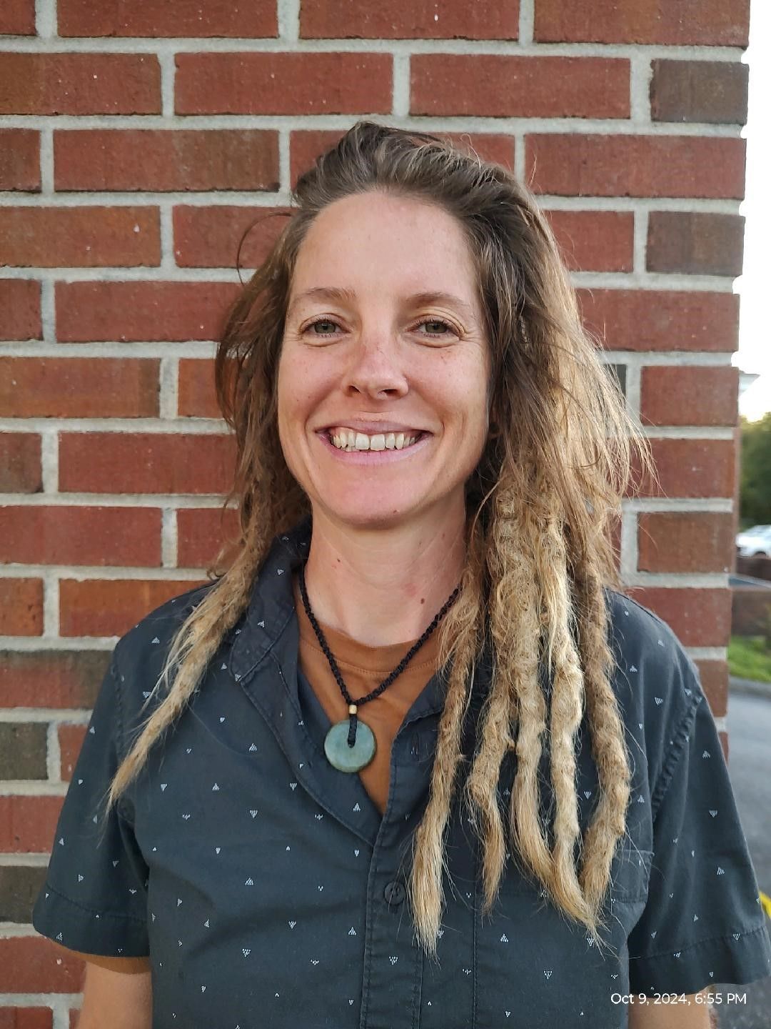 A woman is laying on a table getting a massage.