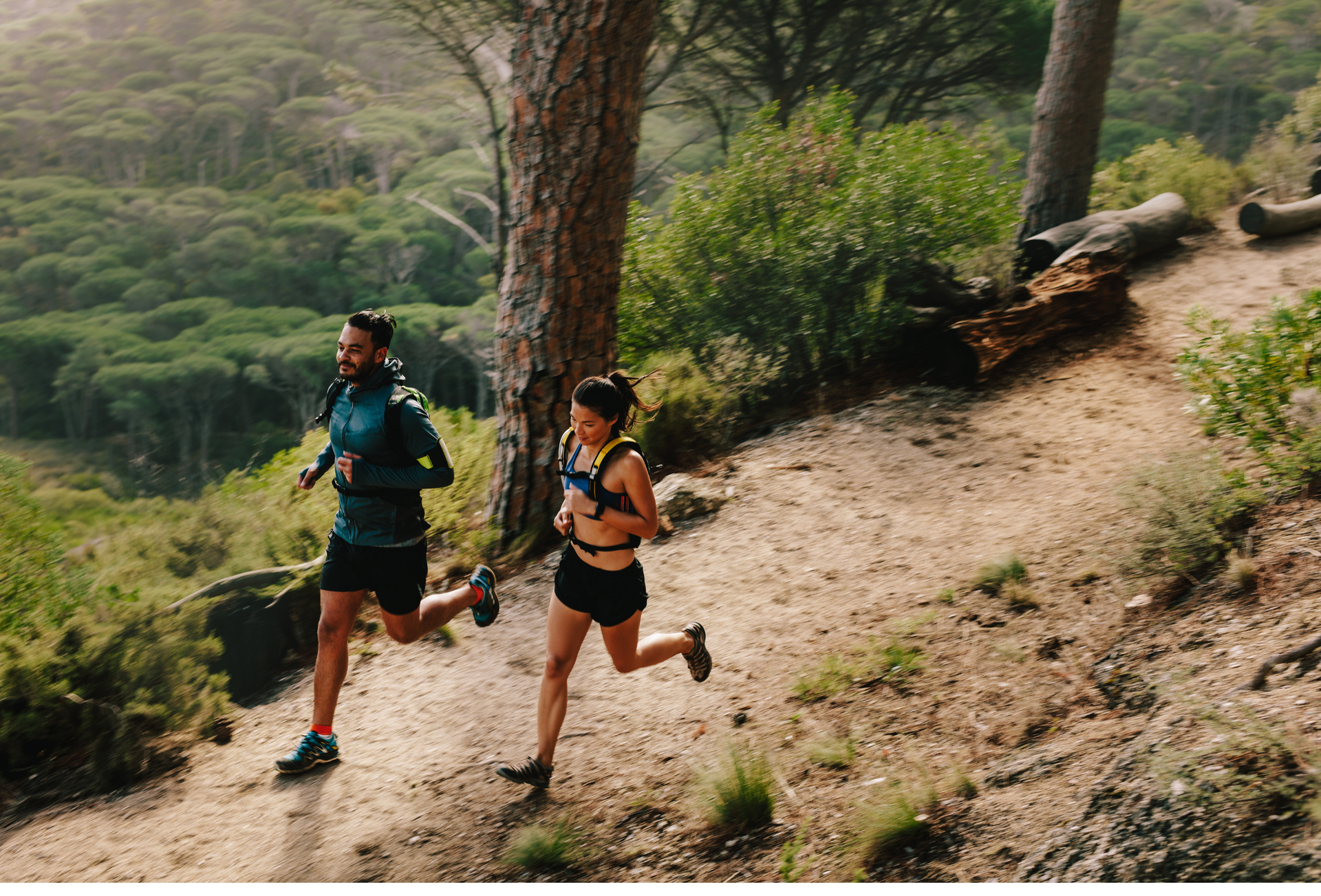 A man and a pregnant woman are standing next to each other in a room.