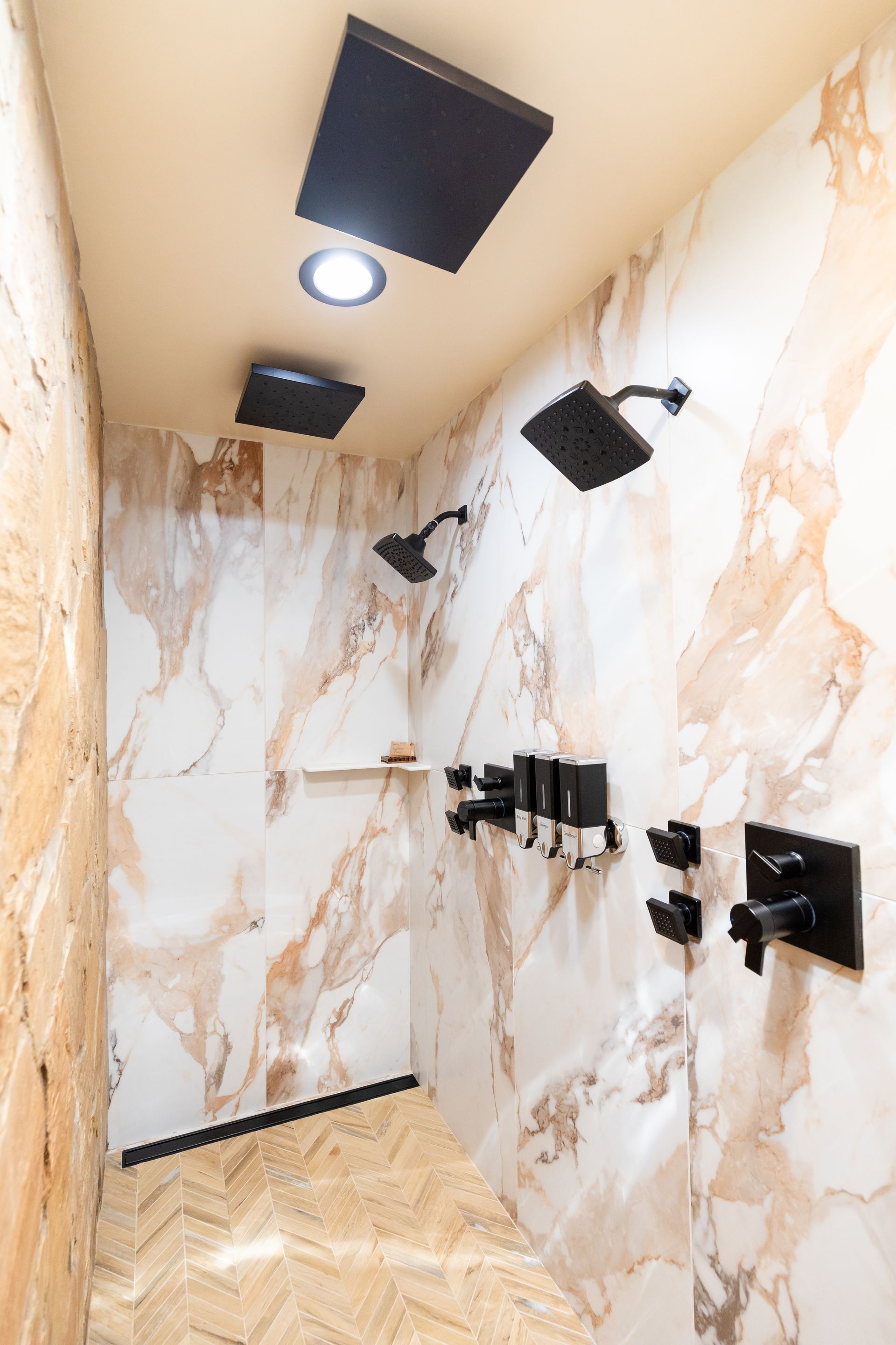 A bathroom in a log cabin with a sink and mirror.