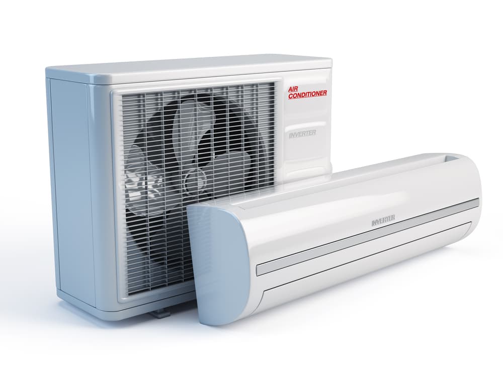 A White Air Conditioner is Sitting Next to a Fan on a White Background — Action Air N Elec in Forest Glen, QLD