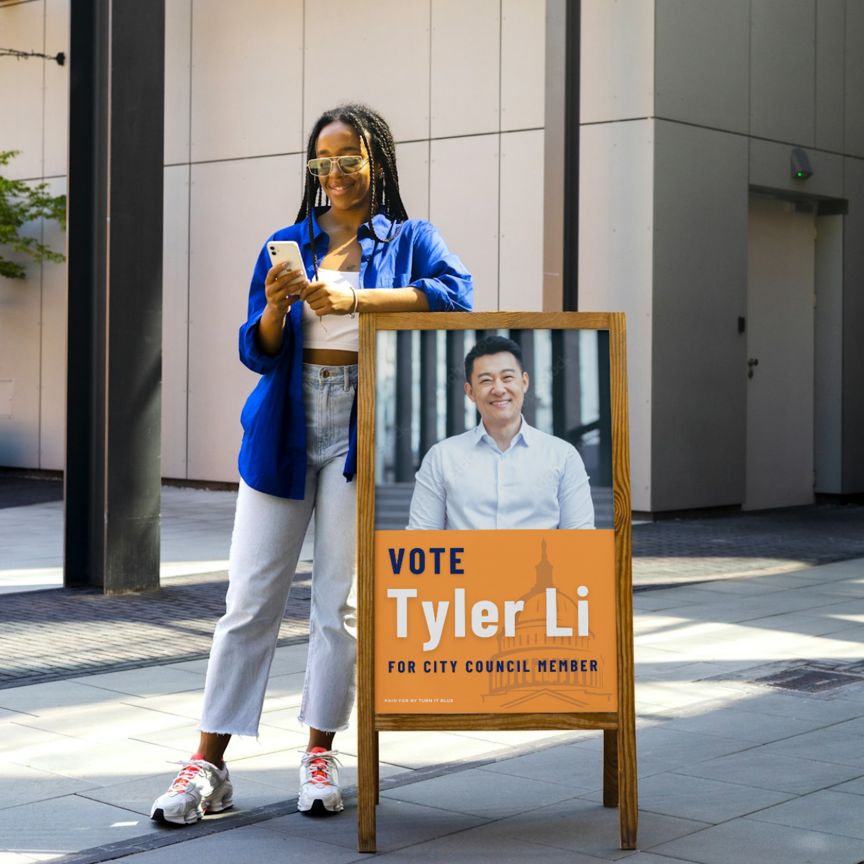 A woman standing next to a sign that says vote tyler li