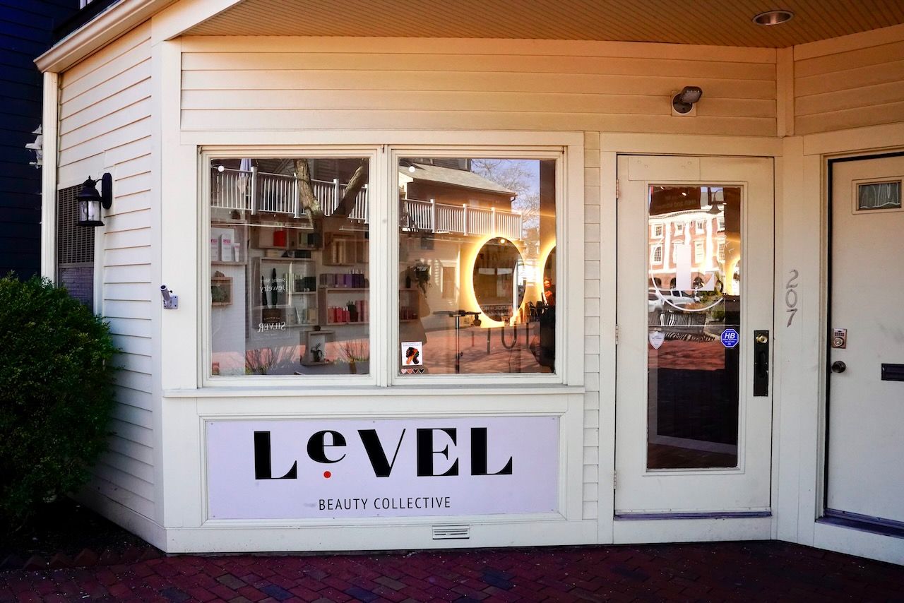 A white building with a sign that says level on it