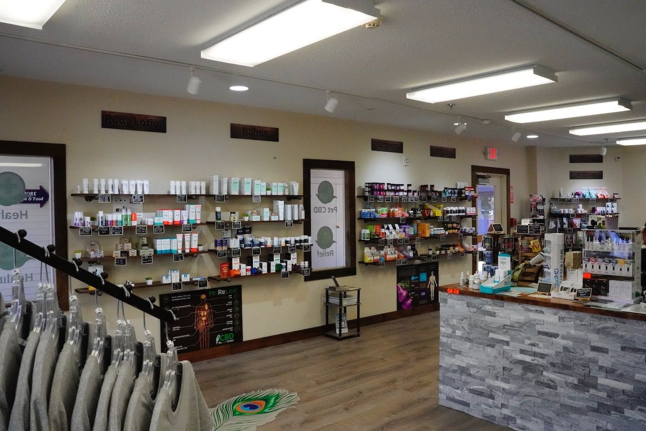 A store with a lot of shelves and a counter.