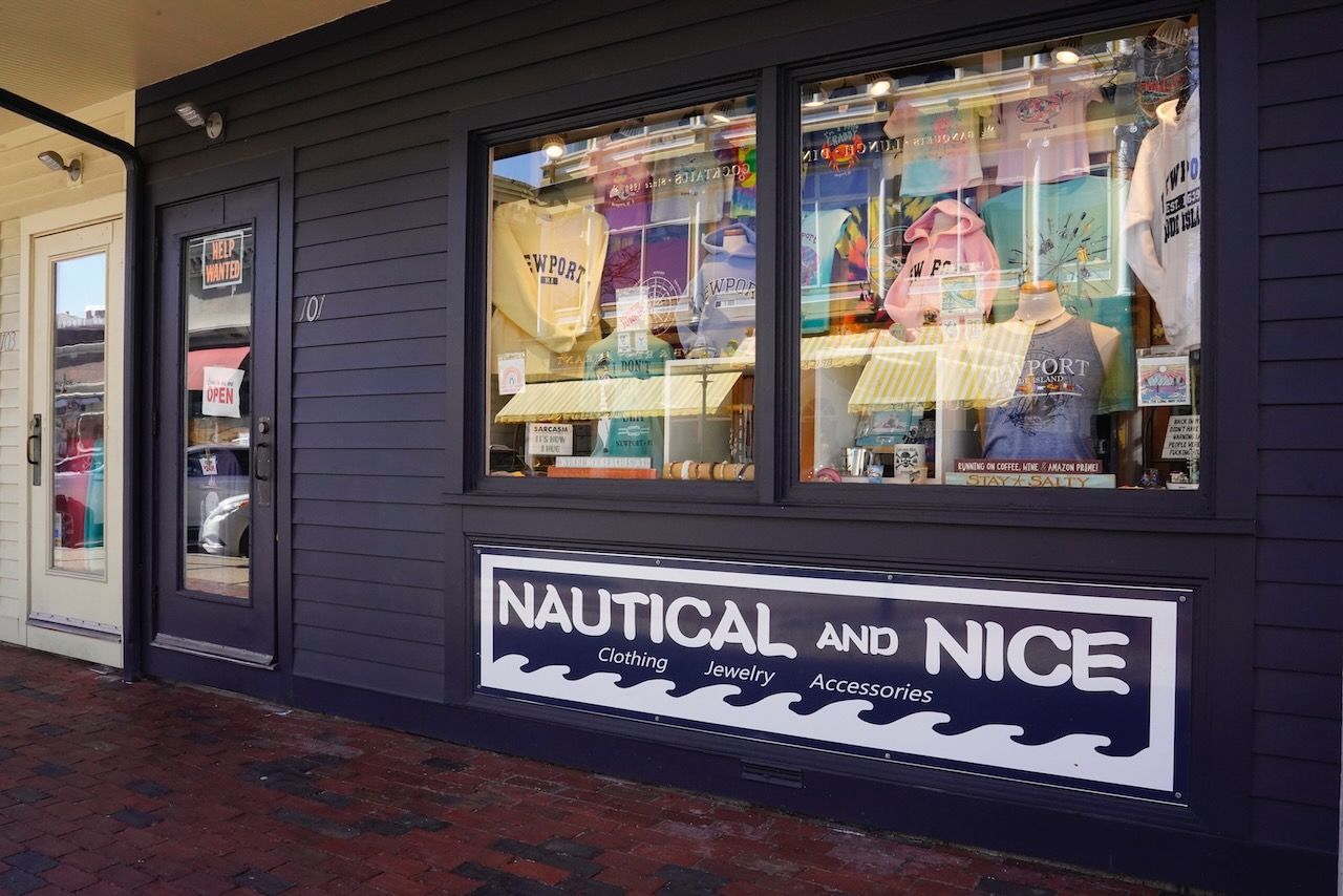 A store front with a sign that says nautical and nice