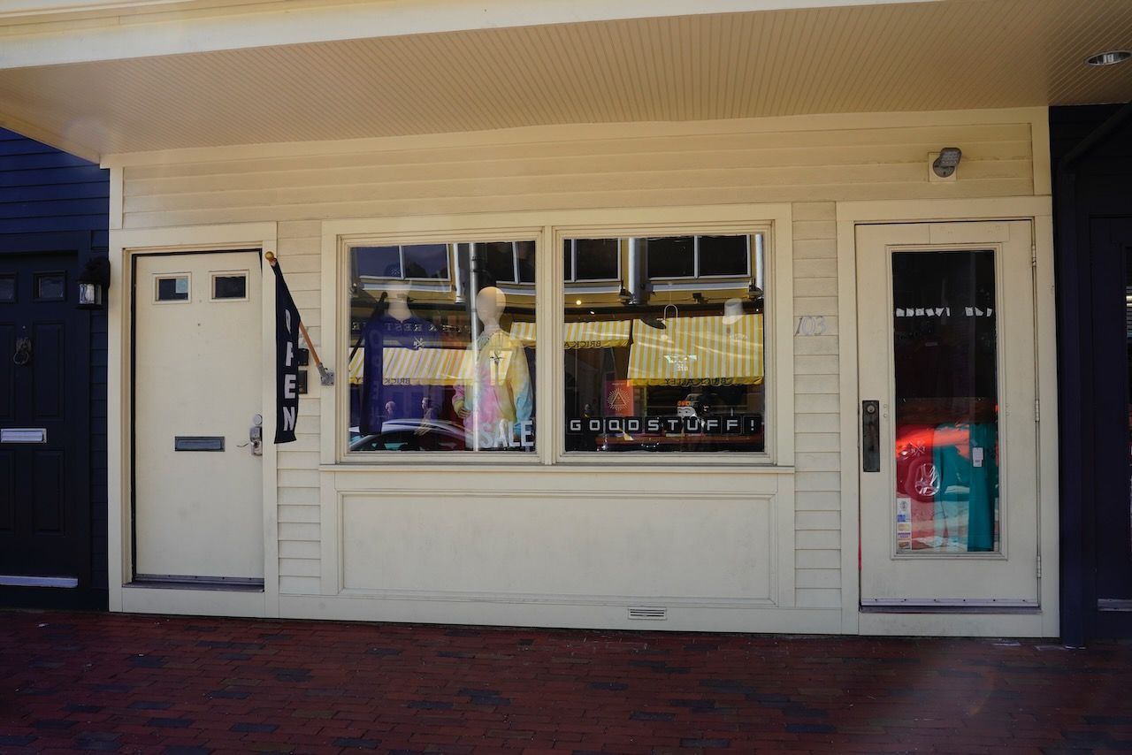 A white building with a window and a door