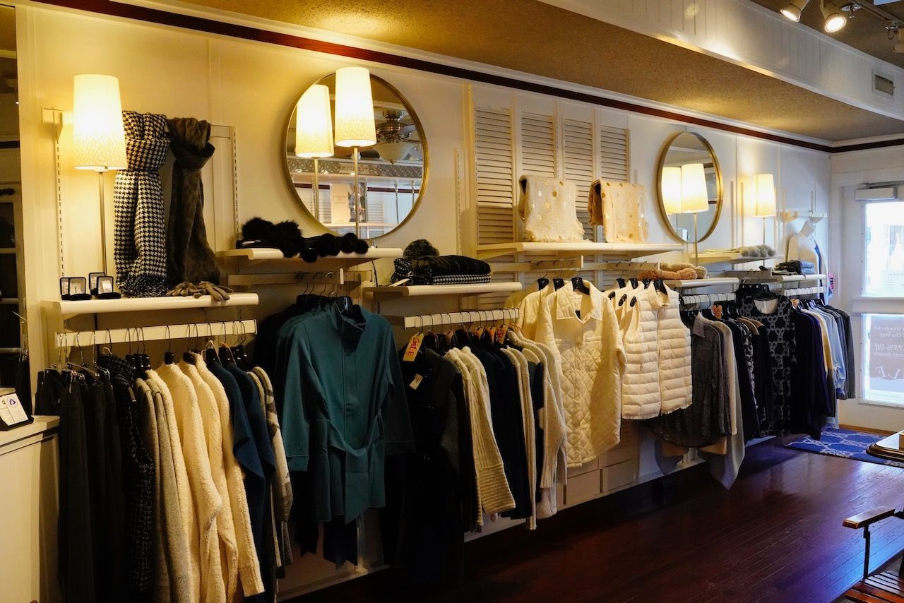 A store filled with lots of clothes and mirrors